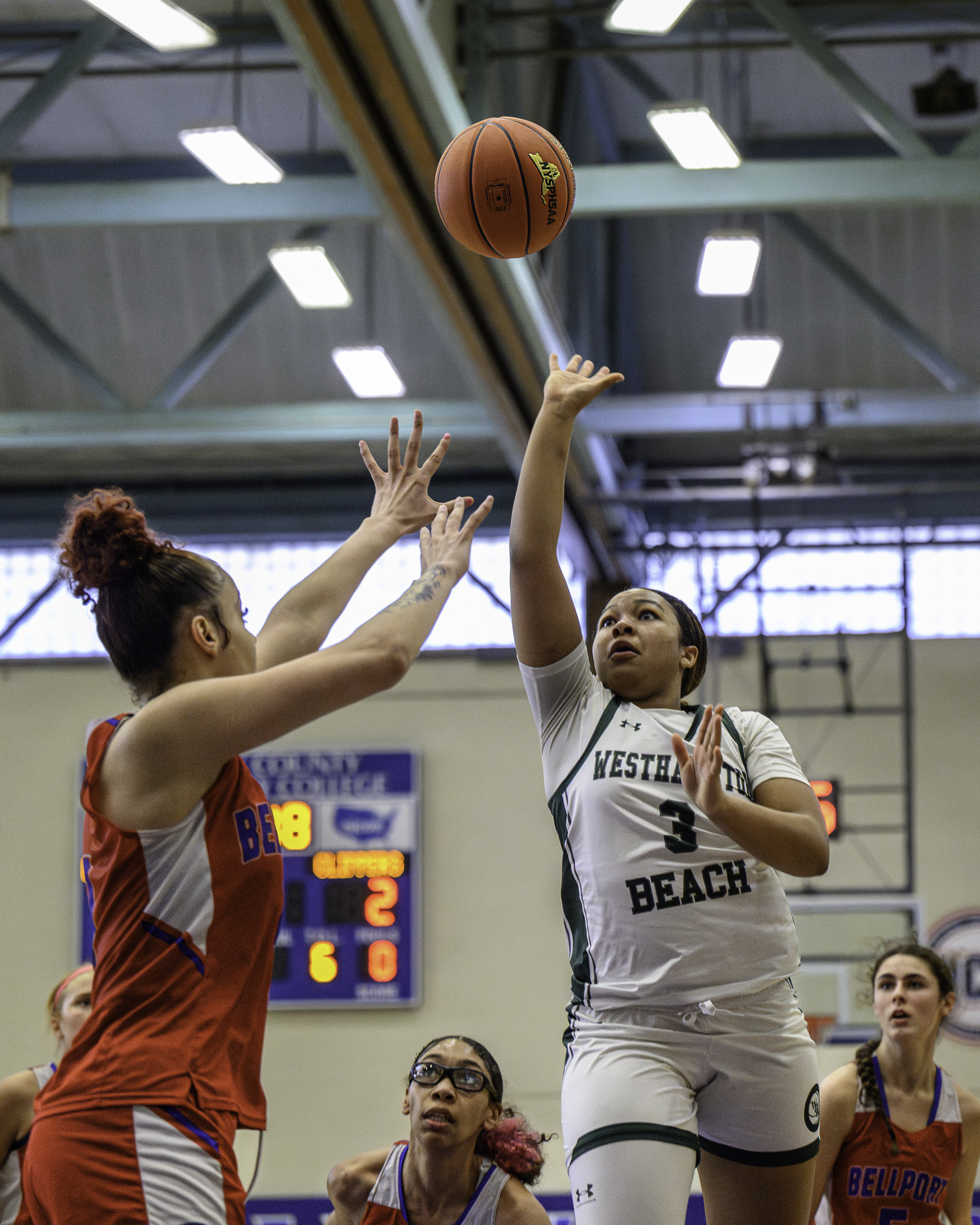 Westhampton Beach sophomore point guard Sandra Clarke shoots through traffic. MARIANNE BARNETT