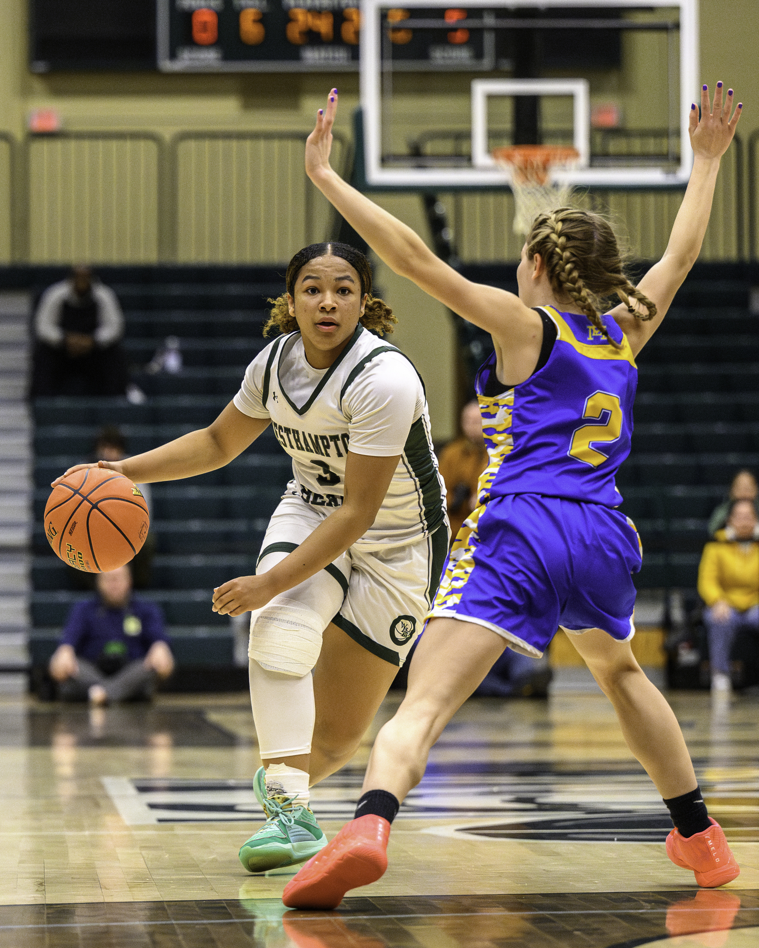 Sophomore point guard Sandra Clarke drives to the basket. MARIANNE BARNETT