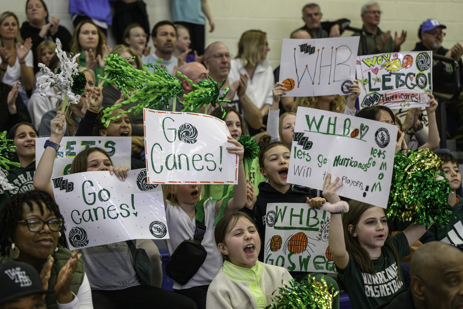 Young Westhampton Beach basketball fans cheer on the girls basketball team. MARIANNE BARNETT