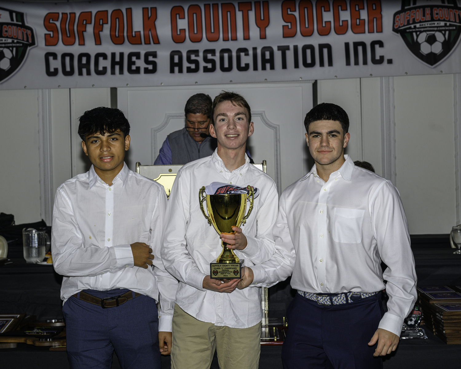 Wilmer Reyes, left, Ryder Esposito and Gus Hayes with the Suffolk County Class C Champion trophy that their Pierson/Bridgehampton boys soccer team won.   MARIANNE BARNETT
