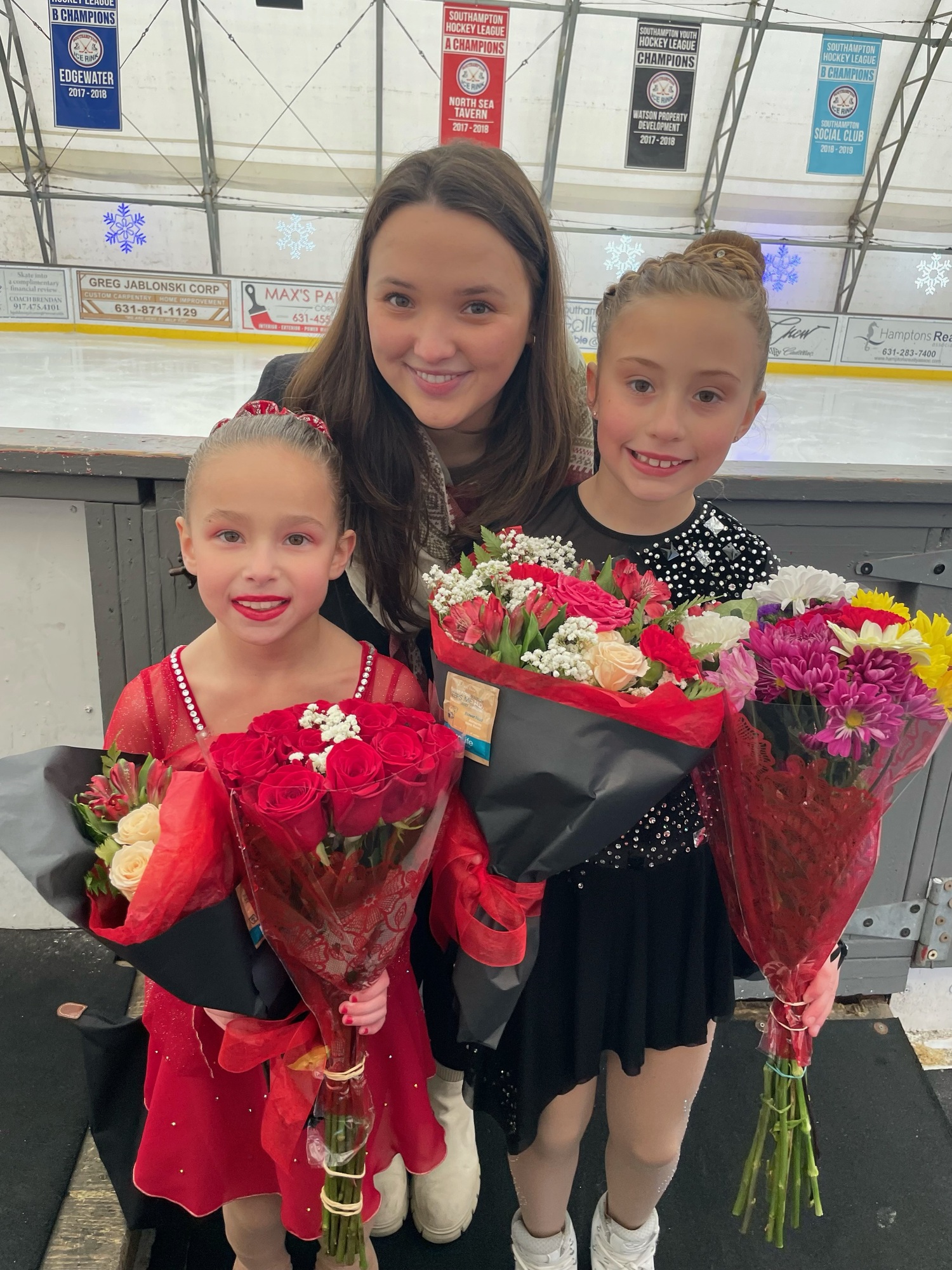 Luna Morgan, left, with her friend Violet Mangi and coach Emma Murphy.      COURTESY SHANE MORGAN