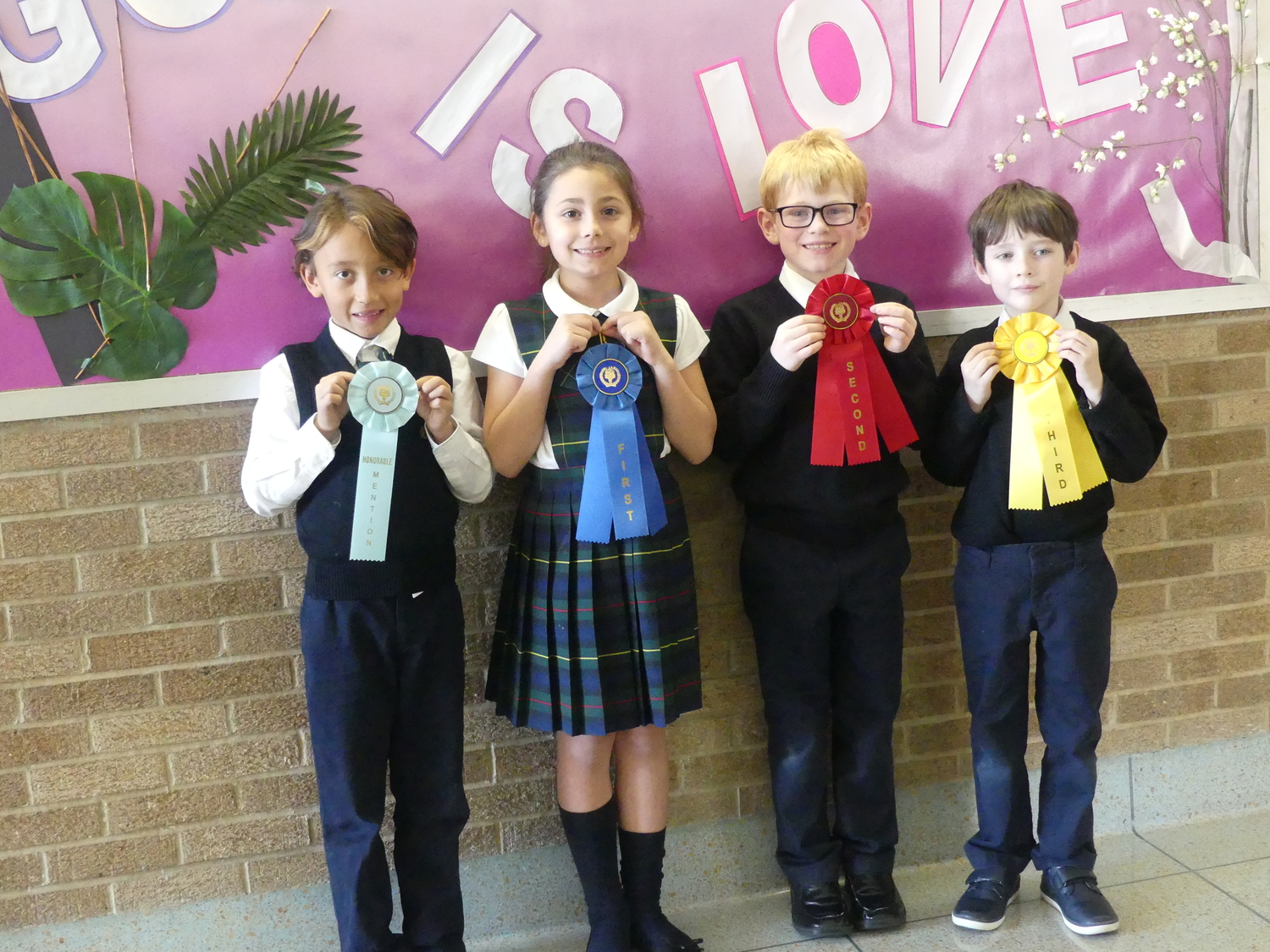 Our Lady of the Hamptons School 's science fair winners from second grade, from left, Harrison Sansone,  Josephina Maimone,  Connor Blodorn, and Colton Wassle. COURTESY OUR LADY OF THE HAMPTONS SCHOOL