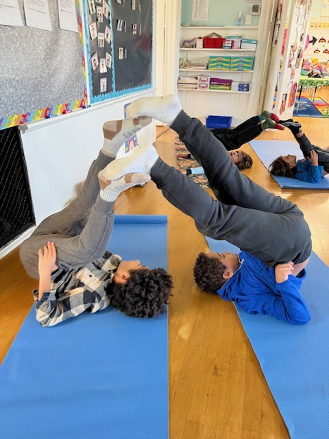 Yoga is the focus right now in physical education at the Sagaponack School. Kristin Davey of Peaceful Planet Yoga leads the students in poses. COURTESY SAGAPONACK SCHOOL
