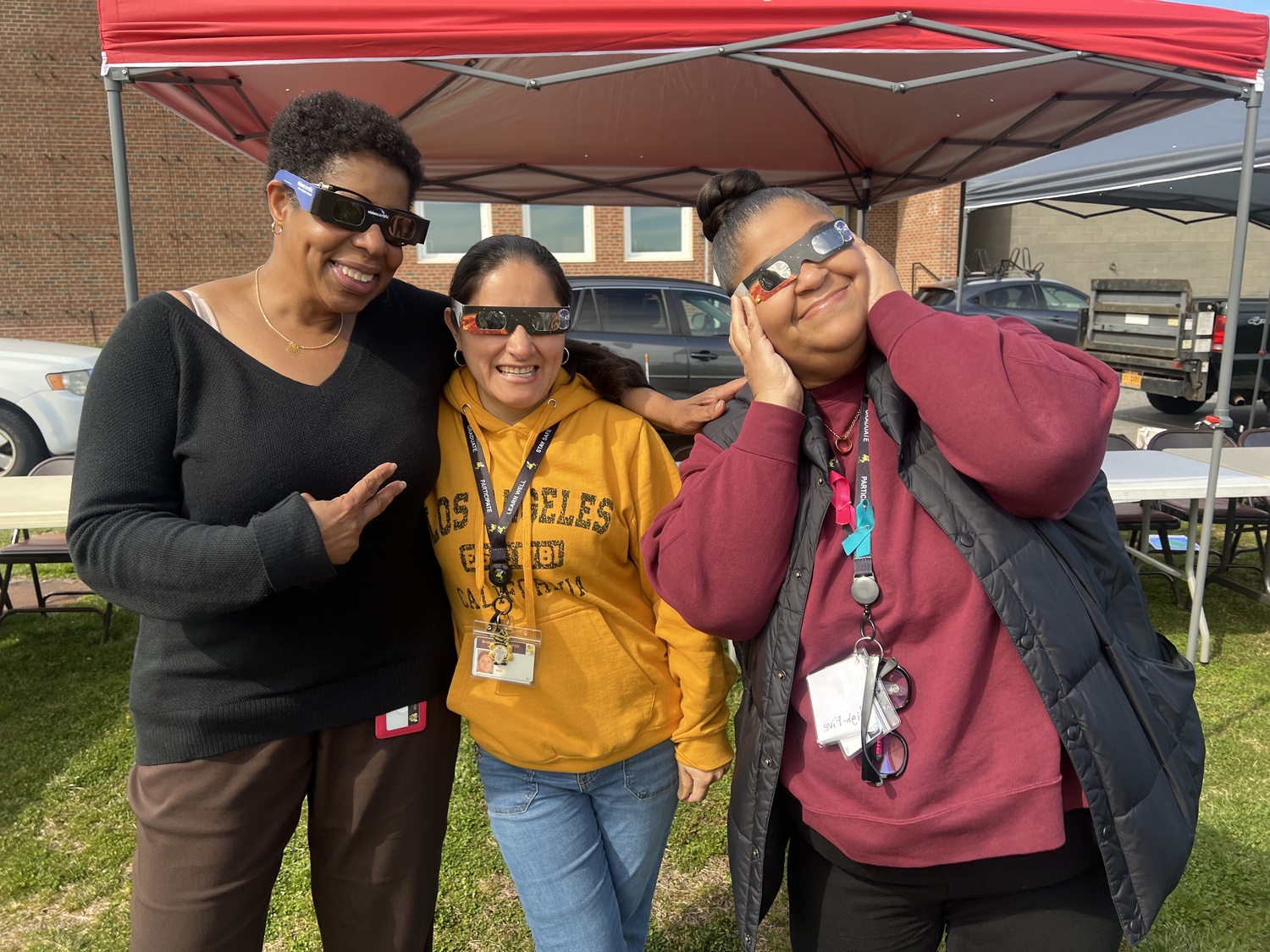 Bridgehampton Union Free School District and community members gathered for a showing of the solar eclipse on April 8. With the protection of eclipse glasses, everyone was able to witness the incredible event. Faculty members Giles Gay, Fubia Garcia and Adrienne Gholson. COURTESY BRIDGEHAMPTON SCHOOL DISTRICT