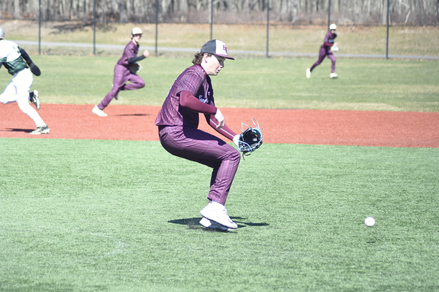 Finn O'Rourke hops off the mound to field the ball.   DREW BUDD