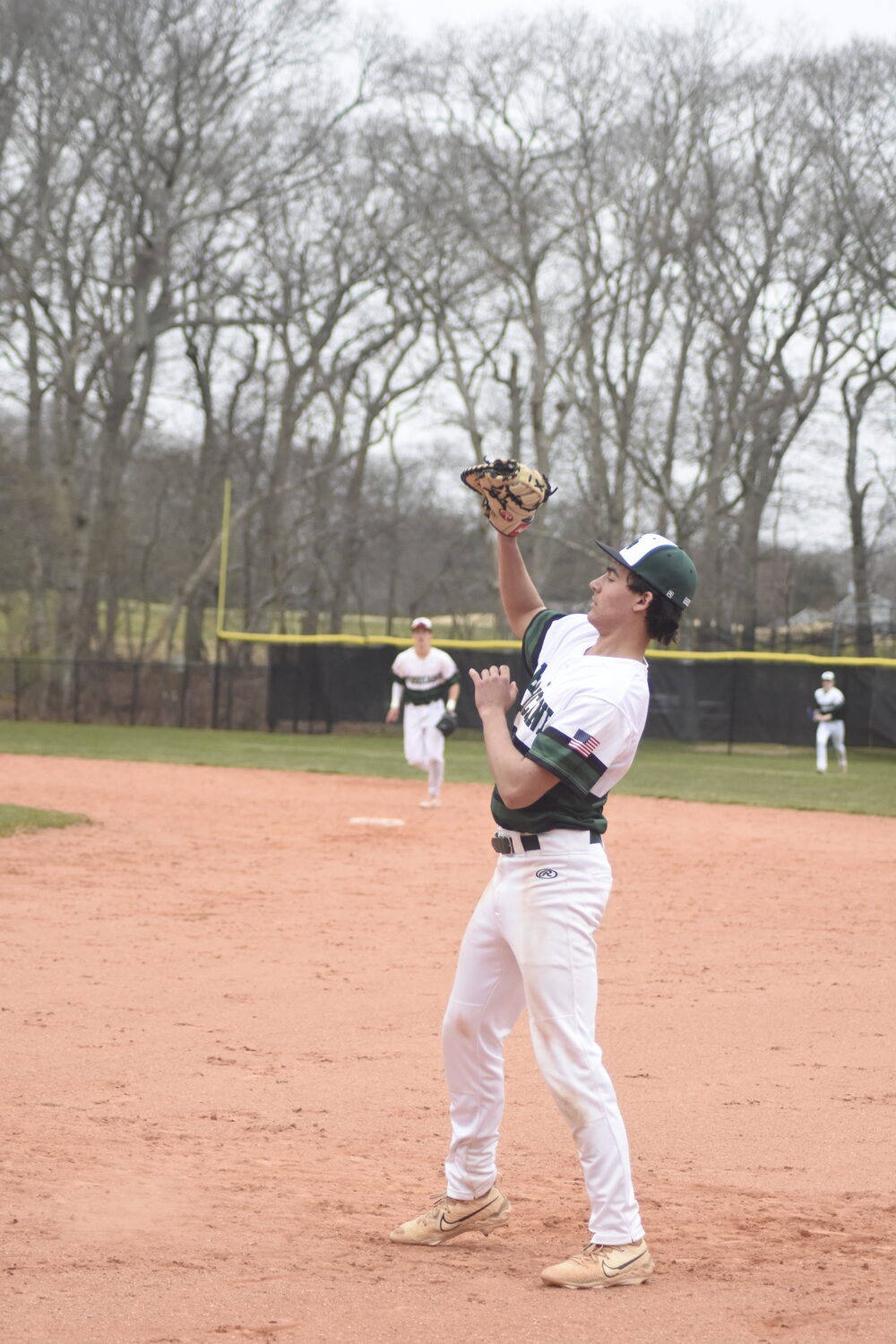 Westhampton Beach first baseman Jude Allen lines up a fly ball in the infield and catches it for an out.   DREW BUDD