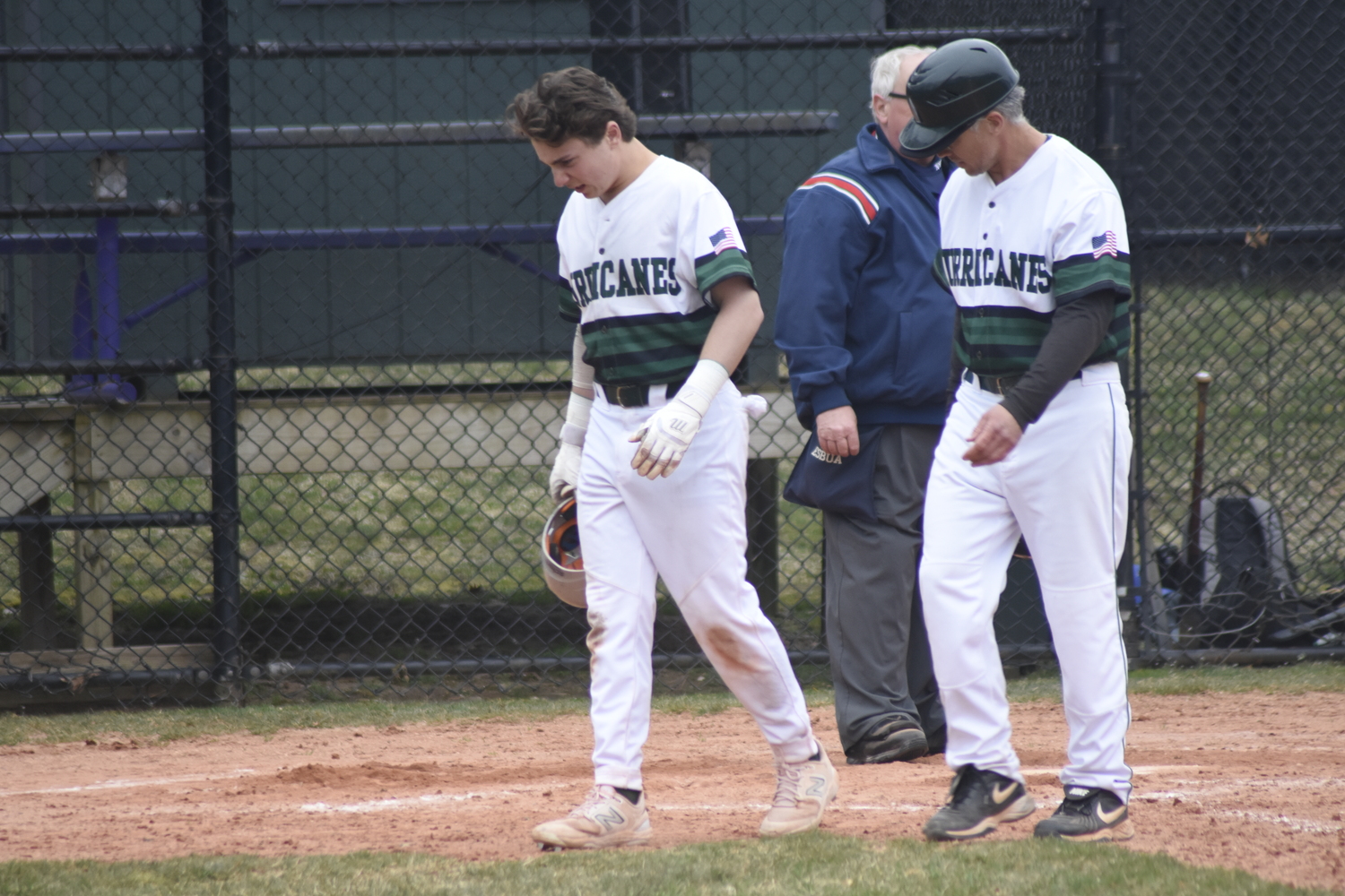 Westhampton Beach senior Ethan Seltzer tries to walk off an injury after fouling a ball hard off his foot. He stayed in the game.   DREW BUDD