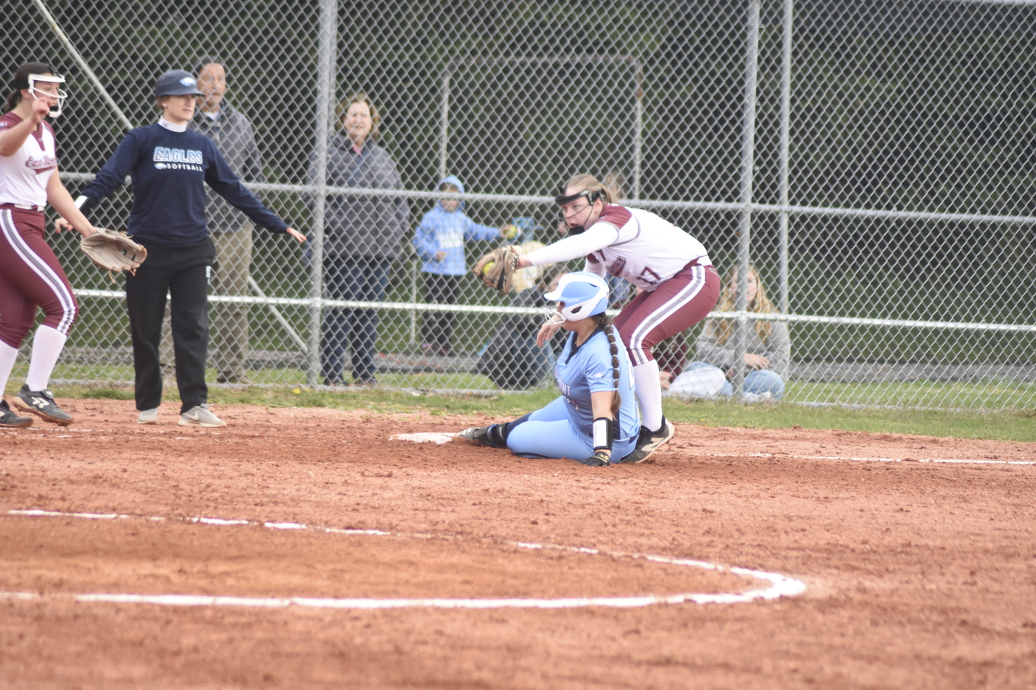 East Hampton junior Susie DiSunno tries to tag out a Rocky Point player at third base. DREW BUDD