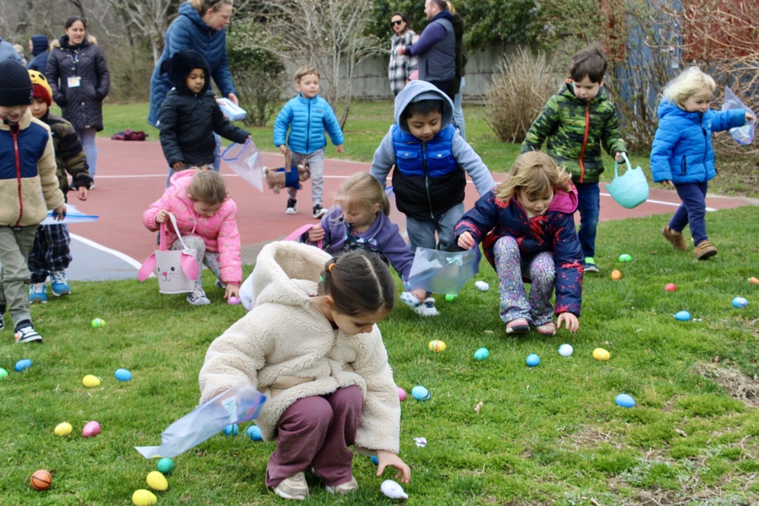 The Bridgehampton School District pre-k to fifth grade students celebrated the start of spring scrambling to find 2,000 eggs donated by students, parents and community members and spread across the school grounds. Hamra Ozsu,  with the help of the elementary school student government, organized the event, which was divided into age groups.  In an effort to reduce waste, the student who brings back the most eggs the following year will receive a prize.  COURTESY BRIDGEHAMPTON SCHOOL DISTRICT