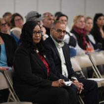 Dr. Fatima Morrell and her husband, James, listen to a Board of Education meeting, which centered on her appointment as the next superintendent of schools at the Southampton Union Free School District. DOUG KUNTZ