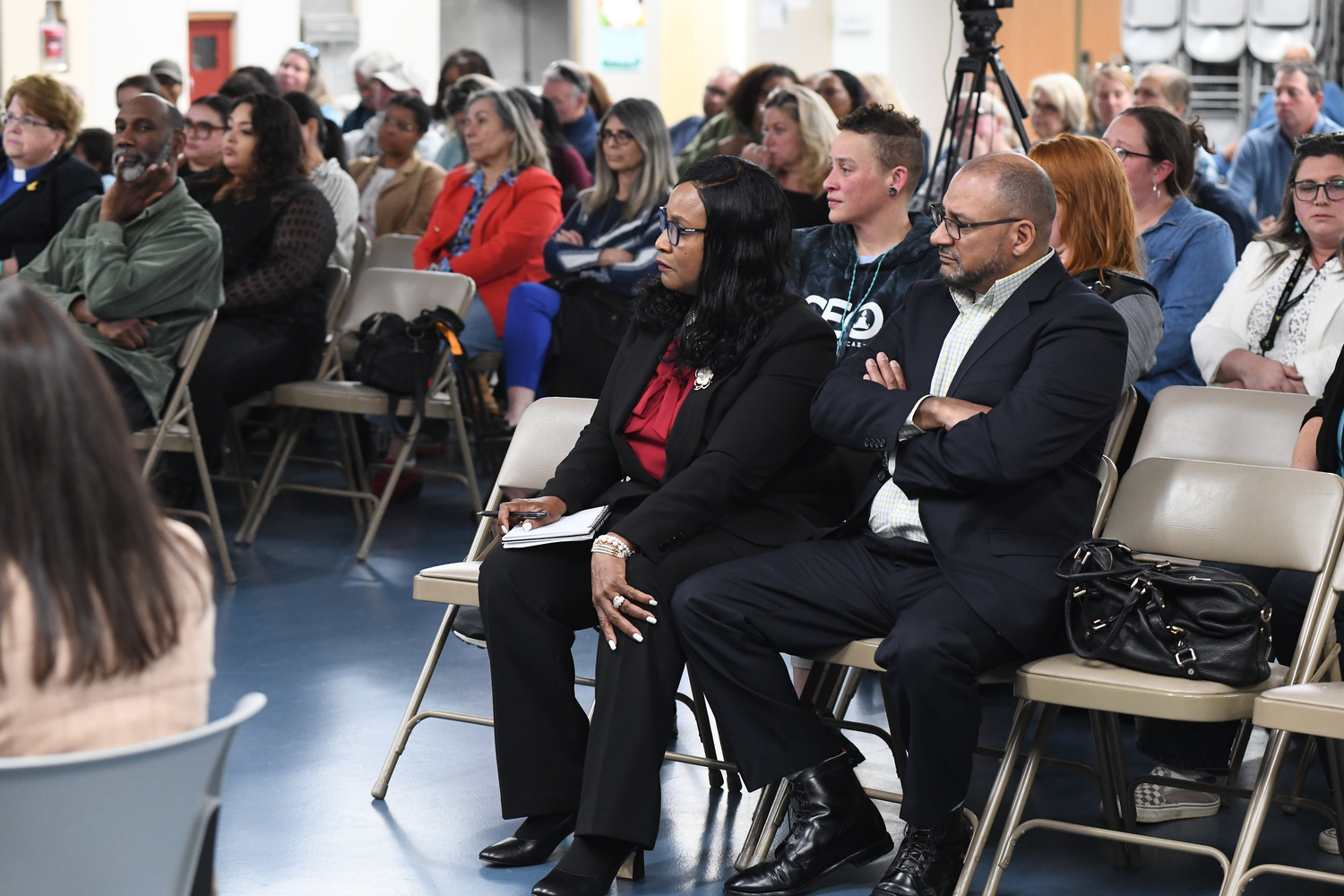 Dr. Fatima Morrell and her husband, James, listen at theBoard of Education meeting, which centered on her appointment as the next superintendent of schools at the Southampton Union Free School District. DOUG KUNTZ