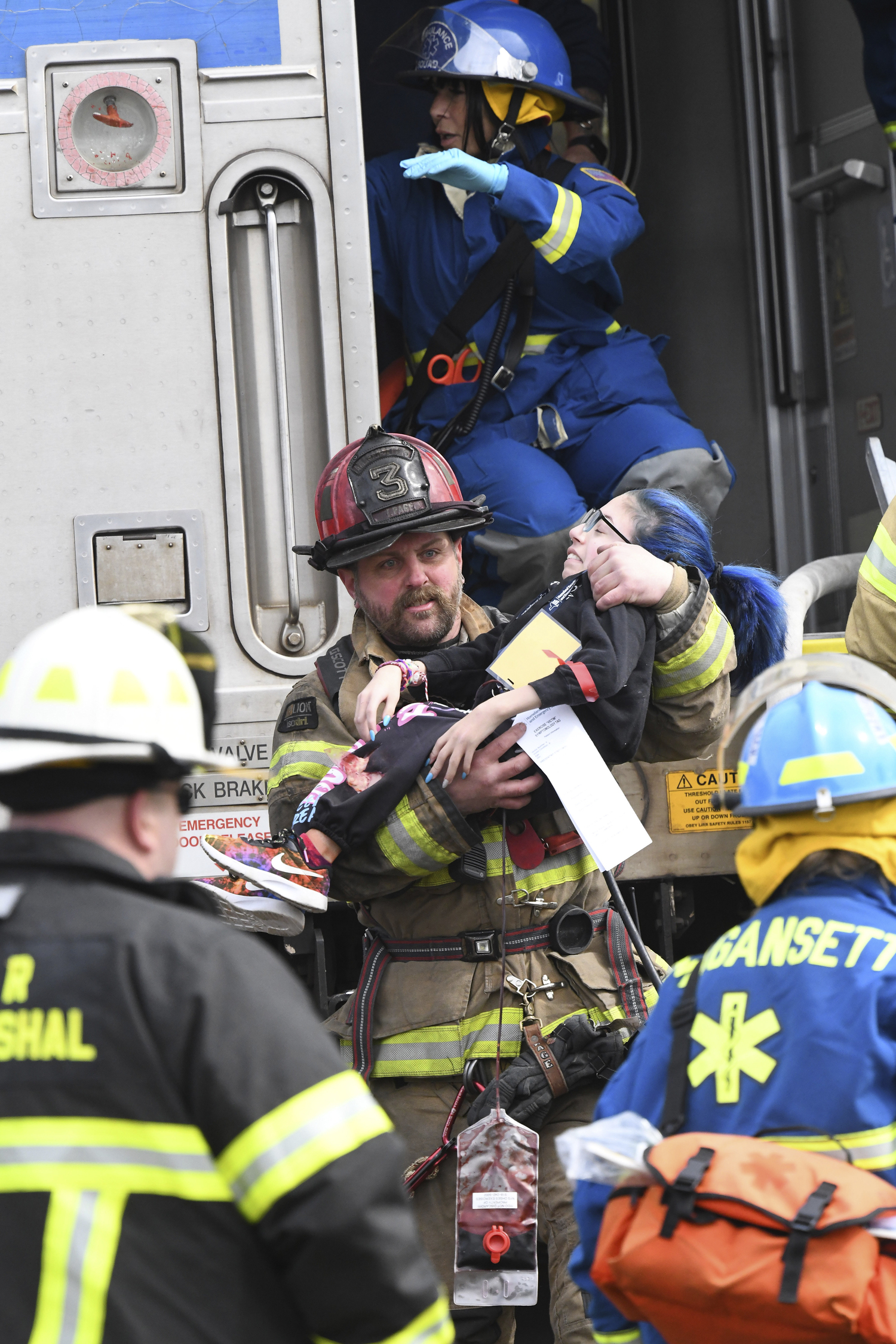 First responders go to work during the full-scale mass casualty drill involving a train accident on Sunday morning in Amagansett.  DOUG KUNTZ