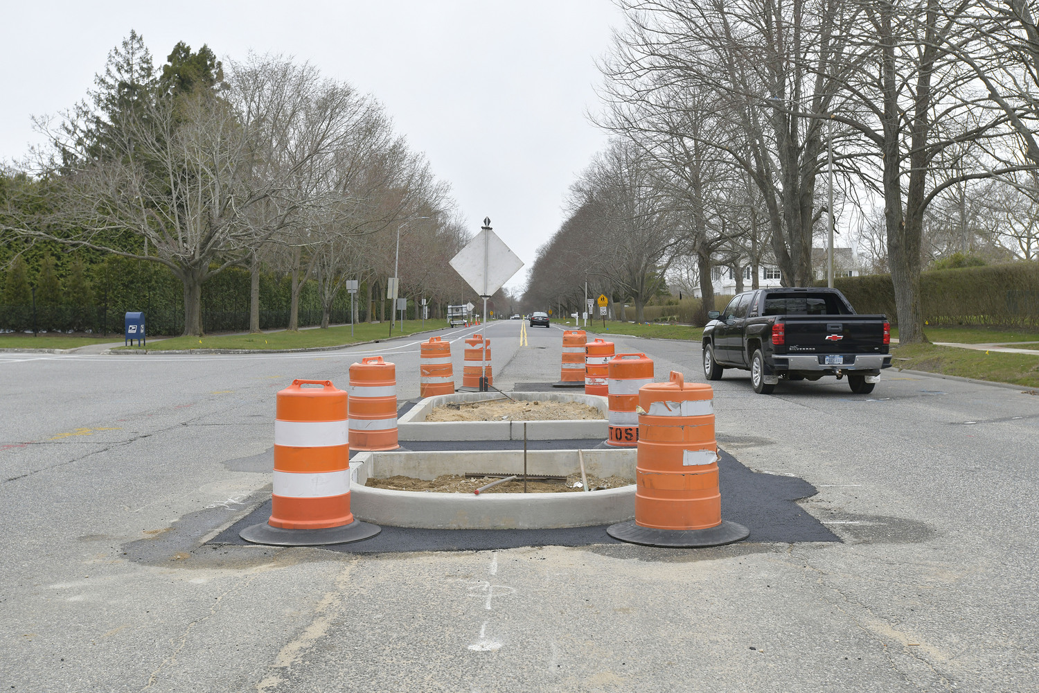 Work began last week in Southampton Village to create a turning lane and pedestrian islands on Hill Street near First Neck Lane and Varadian Way.  DANA SHAW