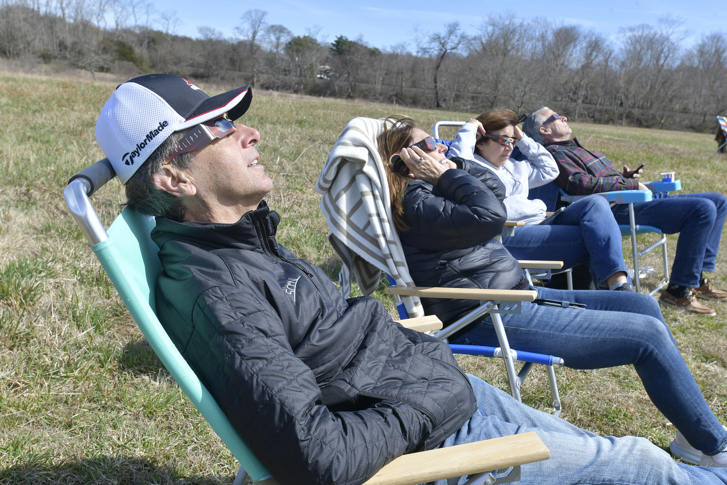 Tom Mazza watches the eclipse at the South Fork Natural History Museum in Bridgehampton on Monday afternoon.