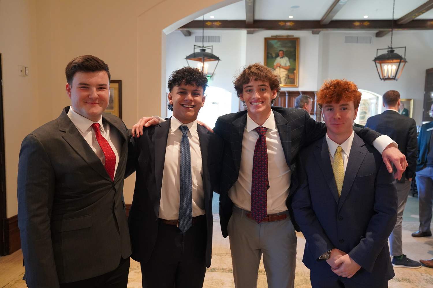 Michael Poremba, left, with the other three Long Island high school seniors who were selected for the Evans Scholarship, which included Joseph Mayal (St. Anthony's High School) and Colin Lynch and Luke Richard, both of Riverhead High School.    WESTERN GOLF ASSOCIATION
