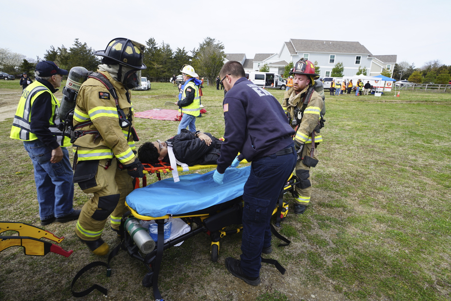 First responders go to work during the full-scale mass casualty drill involving a train accident on Sunday morning in Amagansett.  DOUG KUNTZ