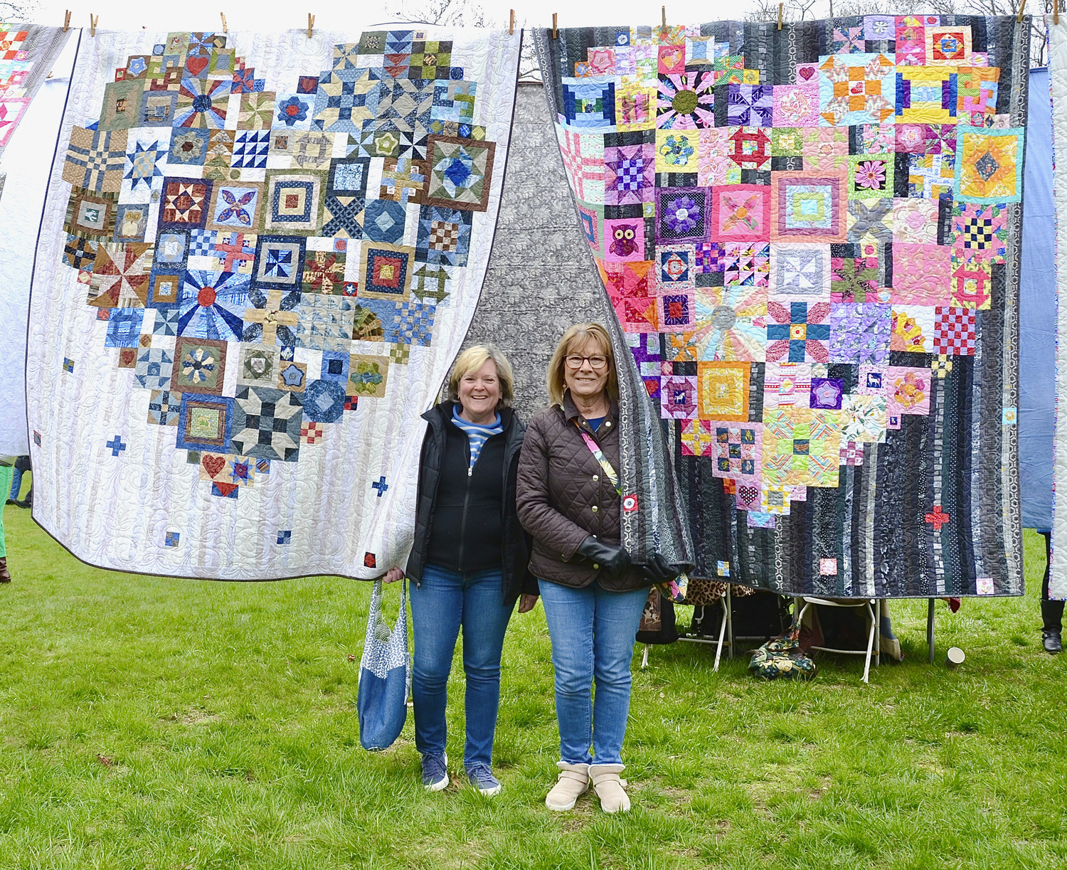 Karen Nicholson and Donna Daley at the Airing of Quilts on Saturday at the Arts Center at Duck Creek in Springs. The event was organized by Louise Eastman and Erica-Lynn Huberty and featured. among others, a bedspread made by Stella Mae McClure Pollock, crafted from Jackson Pollock’s clothing and a quilt by one of Gee’s Bend’s renowned quilters, Leola Pettway.   KYRIL BROMLEY