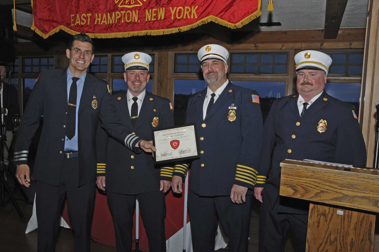 Brian Stanis,Captain of Company No. 2, with the Officer of the Year Award 2023 at the East Hampton Fire Department's 125th Annual Inspection Dinner at the Maidstone Club on Saturday.  RICHARD LEWIN