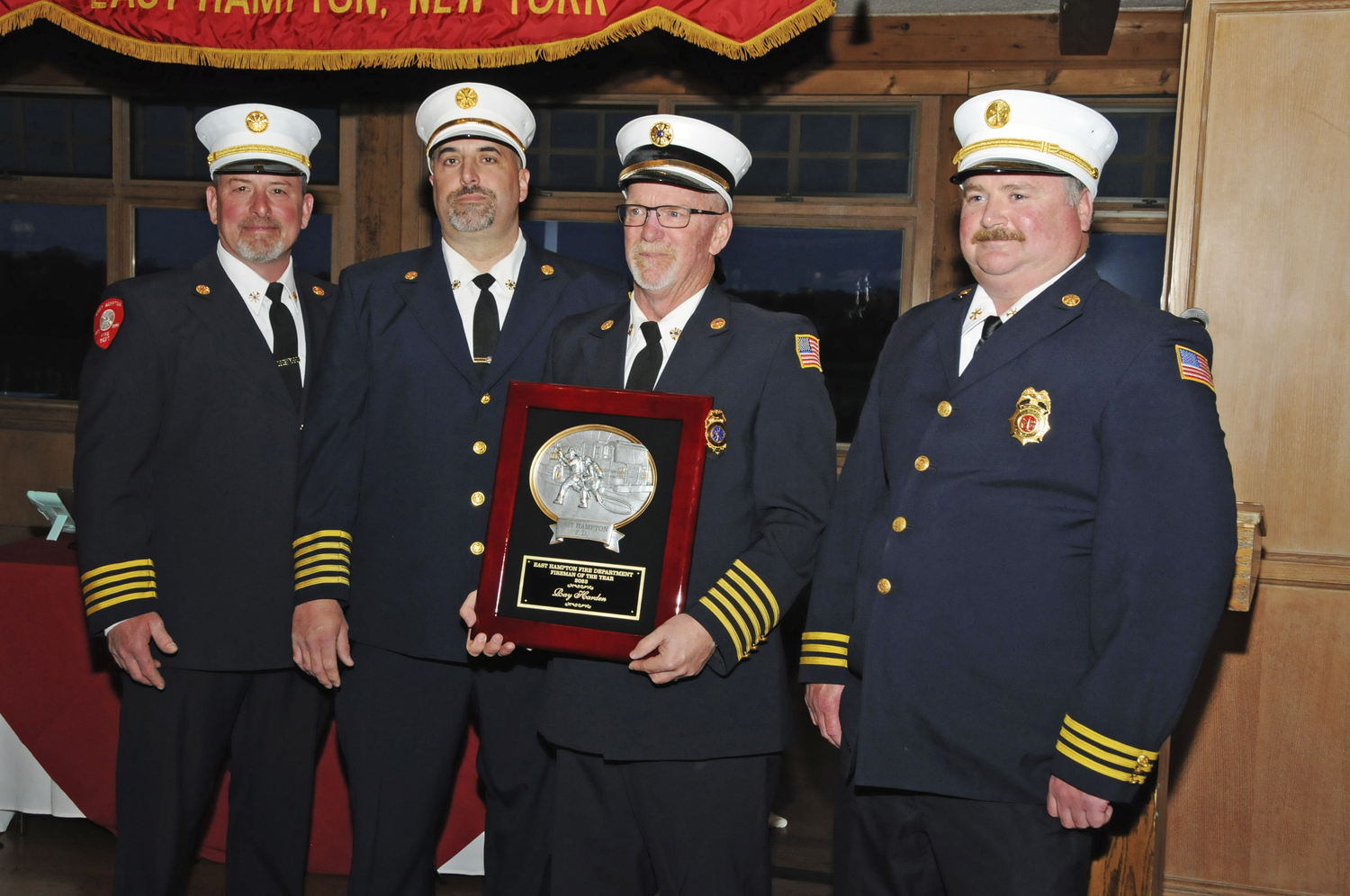 Ray Harden, Company No. 2 Secretary/Treasurer, with the Fireman of the Year 2023 award at the East Hampton Fire Department's 125th Annual Inspection Dinner at the Maidstone Club on Saturday.  RICHARD LEWIN