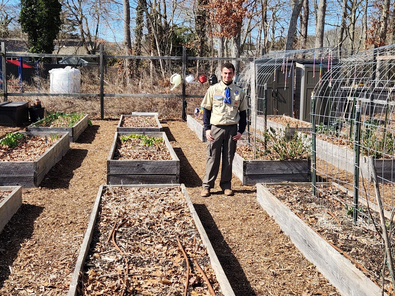 Scout Christian Capolino, a sophomore at Eastport-South Manor Jr.-Sr. High
School, led Troop 221 in the construction of four benches, a flower box with sunflowers, as
well as a sign on the entrance gate of the East Quogue School garden as part of an Eagle
Scout project. Together, Christian and Troop 221 cleaned up the area in and around the garden to benefit the school and the community. Florence Lumber, John Linquist and Stephanie Rempe made donations that made the project possible. COURTESY EAST QUOGUE SCHOOL DISTRICT