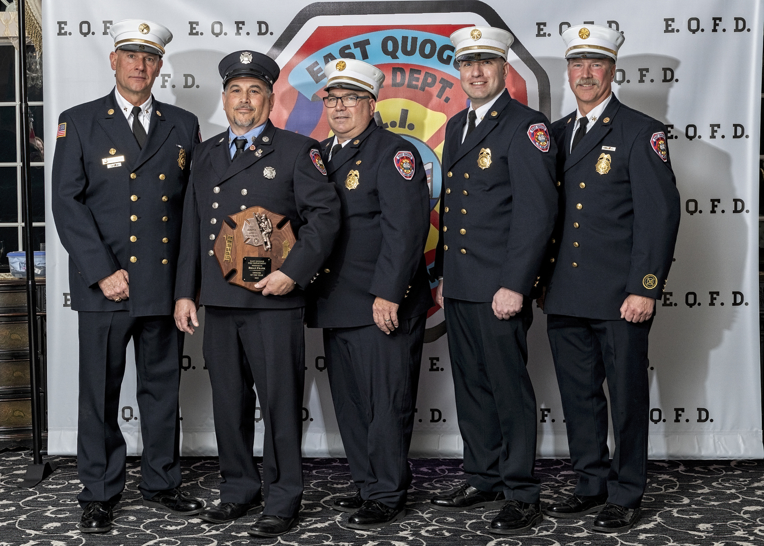 The East Quogue Fire Department held its annual dinner at Georgio’s in Calverton on March 22. Brian Frank, holding plaque, was honored as Officer of the Year. With him are, from left, Third Assistant Chief Mark Gregory, Chief Paul Sulzinski, First Assistant Chief Keith Phillips, and Second Assistant Chief Glenn Bullock.    COURTESY WESTHAMPTON BEACH FIRE DEPARTMENT