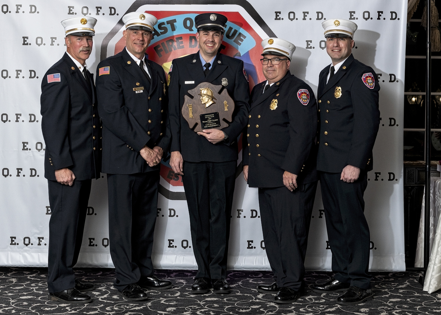 The East Quogue Fire Department held its annual dinner at Georgio’s in Calverton on March 22. William “Alex” Gladding, center, was honored as the 2023 Firefighter of the Year. With him are, From the left Second Assistant Chief Glenn Bullock, Third Assistant Chief Mark Gregory, Chief Sulzinski, and First Assistant Chief Keith Phillips.  Tower Ladder 7-6-11 was named the Truck Crew of 2023. Years of service awards were also given. William Gladding, Kenneth Roussell, and Keith Phillips for ten years. David Rosante and Anthony Lombardi for fifteen years. Edward Seltenreich for twenty-five years. Glenn Bullock for 35 years. James Schaefer for forty-five years. And Anthony Danowski for fifty-five years. COURTESY WESTHAMPTON BEACH FIRE DEPARTMENT