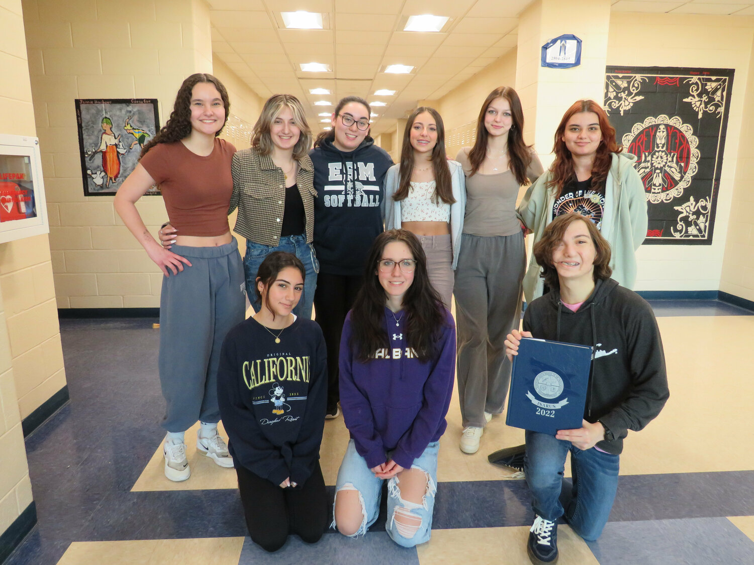 The Eastport-South Manor Jr.-Sr, High School “Stargazer” yearbook club members who garnered an honorable mention in Jostens’ “Look Book” include, back from left, Kalei Strelecki, Bianca Snow, Kim Cotrel, Liliana Recine, Yevheniya Rozmarynovych, Seleme Reyyan Gulbahce, and front from left, Morgan Lally, Alexandra Fay and Riley Bivona. Class of 2023 graduate Fiona Schlegel also contributed. COURTESY EASTPORT-SOUTH MANOR SCHOOL