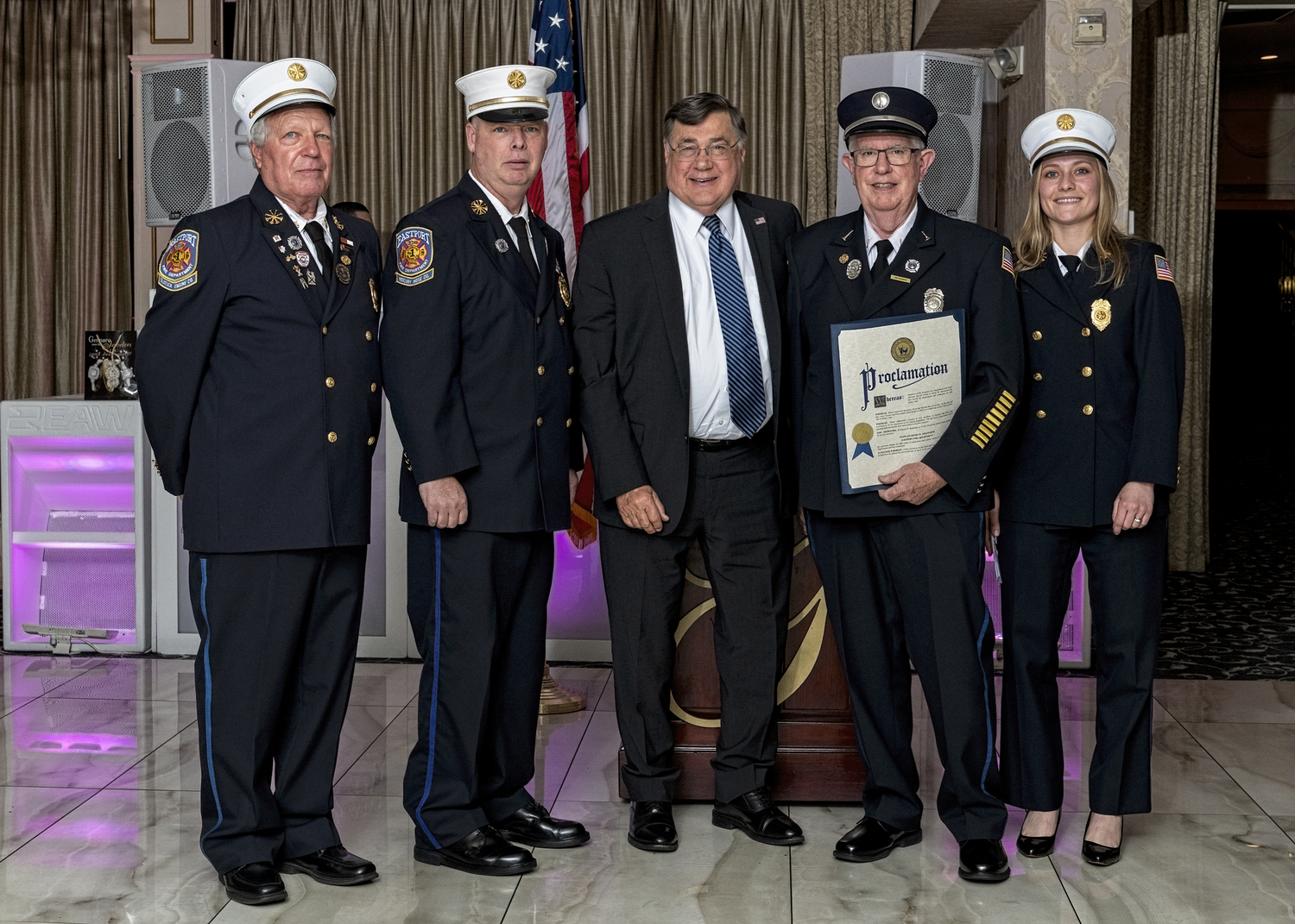 Lieutenant Henry Adelwerth, second from right, received a fifty years of service award at the Eastport Fire Department's 2024 Installation Dinner at Georgio’s in Calverton on  April 13. With him are First Assistant Chief Steven Schaefer, Chief John Dalen, Suffolk County Executive Edward Romaine, and Second Assistant Chief Virginia Massey.   COURTESY EASTPORT FIRE DEPARTMENT