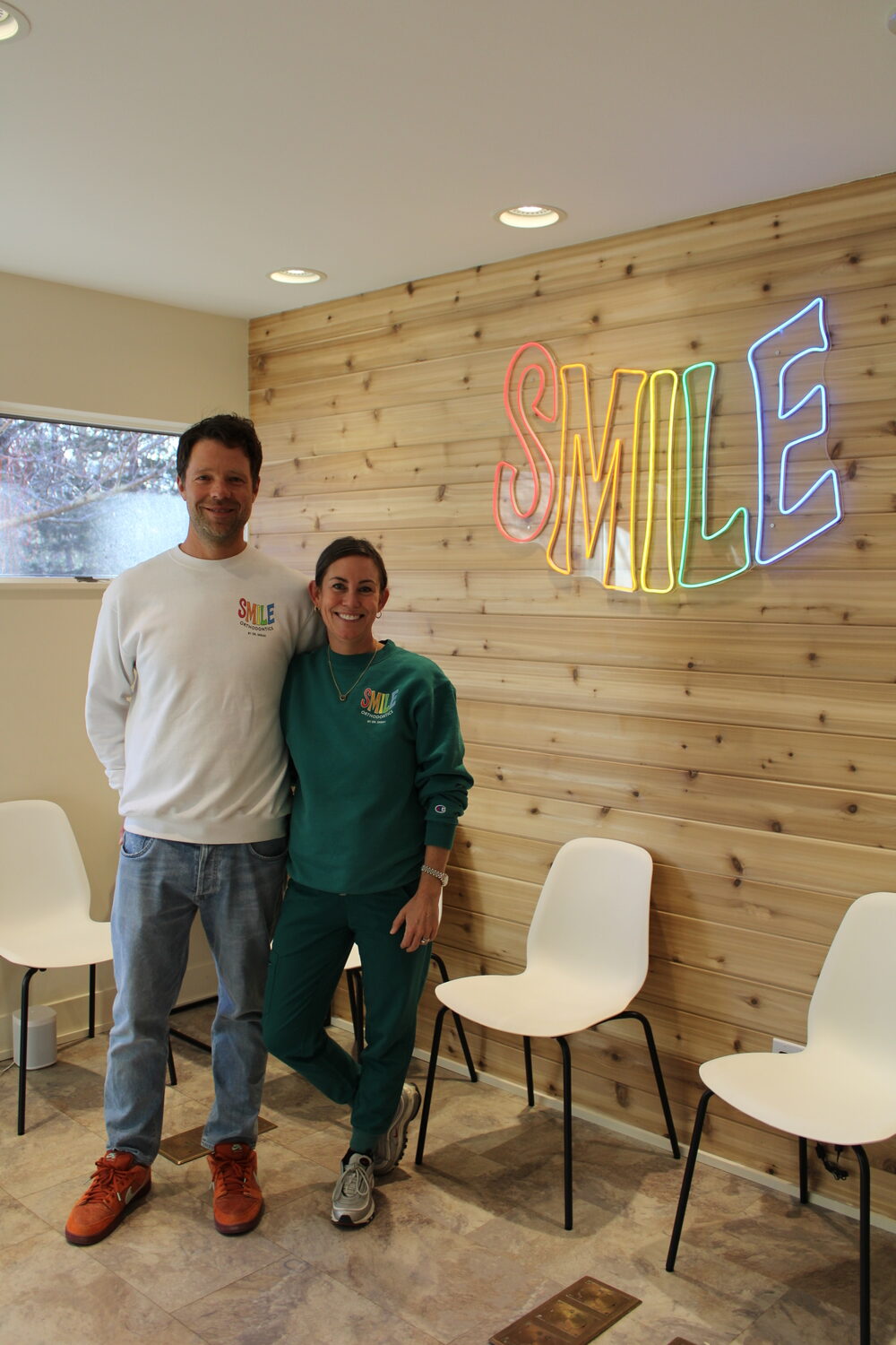 Paul and Sarah Schroetter in the East Hampton office of Smile Orthodontics, which offers braces to two needy kids per year. ELIZABETH VESPE