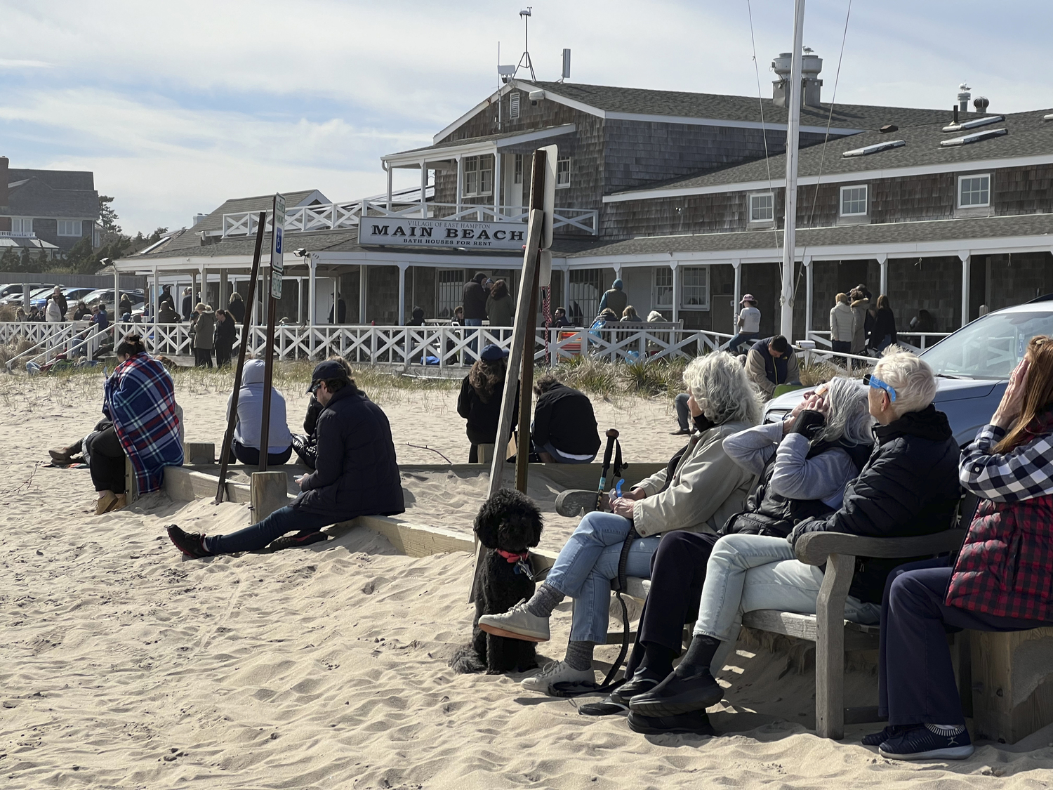 Visitors to Main Beach in East Hampton watch the eclipse on Monday afternoon.