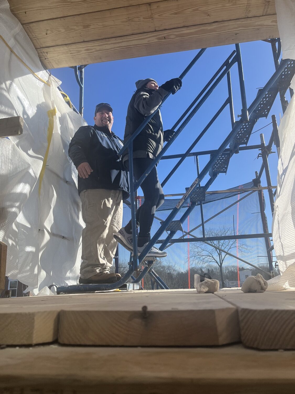 Southampton Village Deputy Mayor Gina Arresta, right, with Steve Phillips, head of the village's department of public works, inspecting work being done on the exterior of village hall. COURTESY SOUTHAMPTON VILLAGE