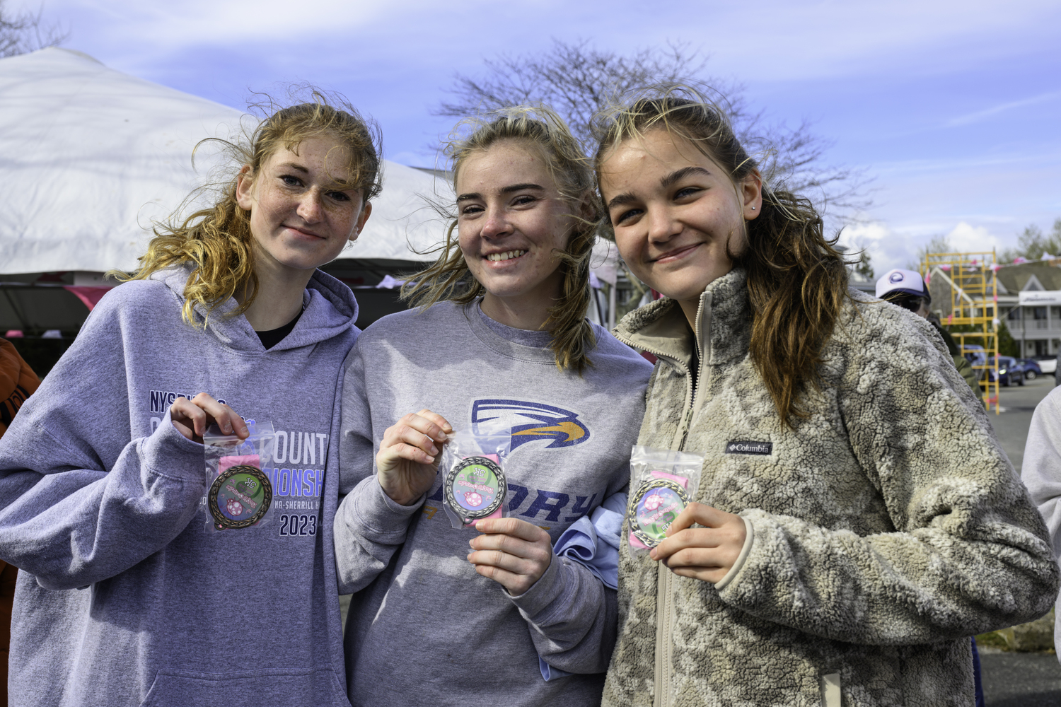 Sara O'Brien, left, Ryleigh O'Donnell and Greylynn Guyer. All three were the top runners in their age group.   MARIANNE BARNETT