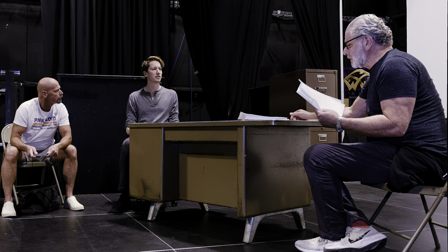 Joe Pallister (as Ariel), John Kroft (as Katurian), and, in foreground, Edward Kassar (as Tupolski) during rehearsals of Martin McDonagh's 
