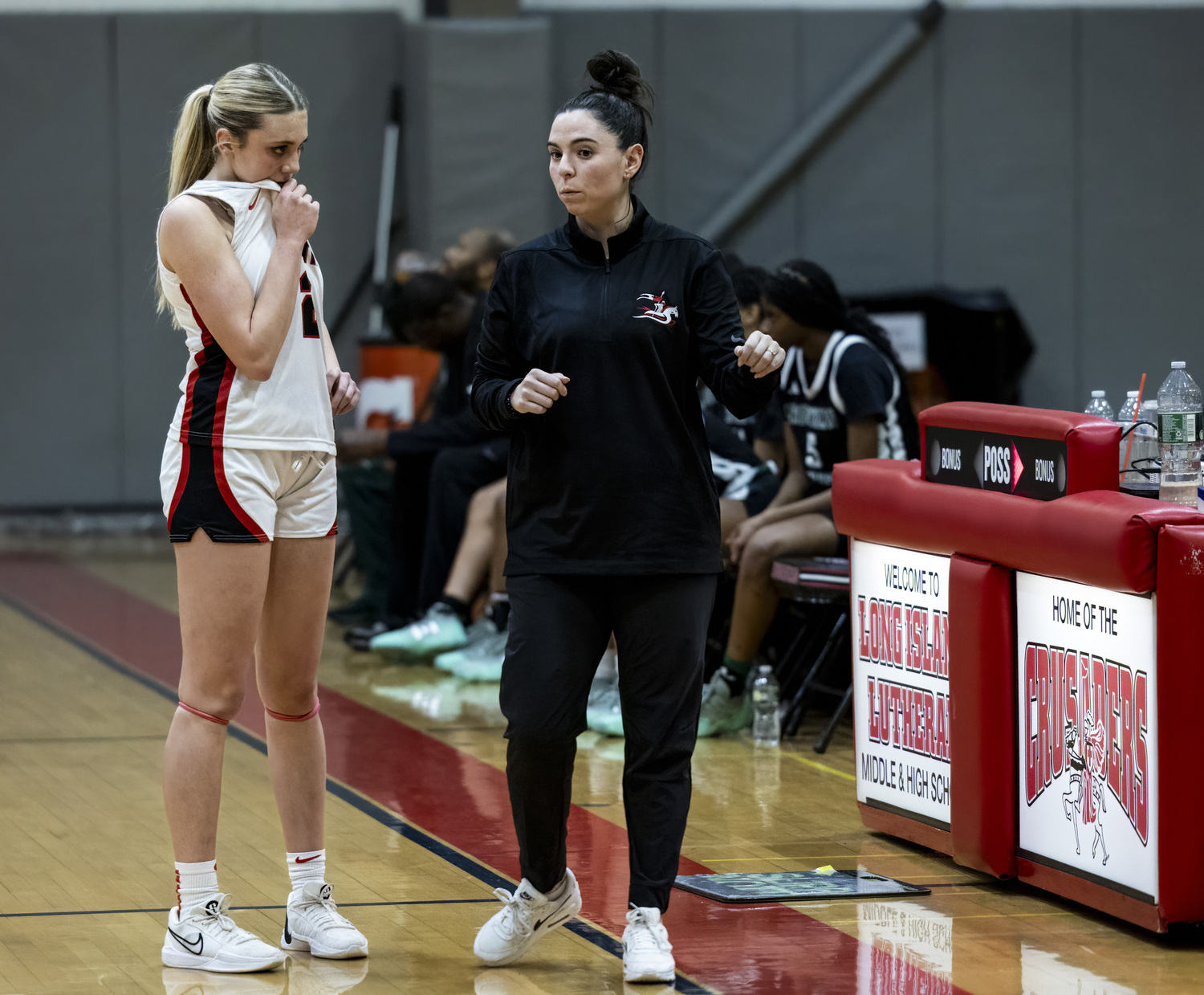 Long Island Lutheran head coach Christina Raiti speaks to Coco Lohmiller during a break in the action. M. FIDEL PHOTOGRAPHY