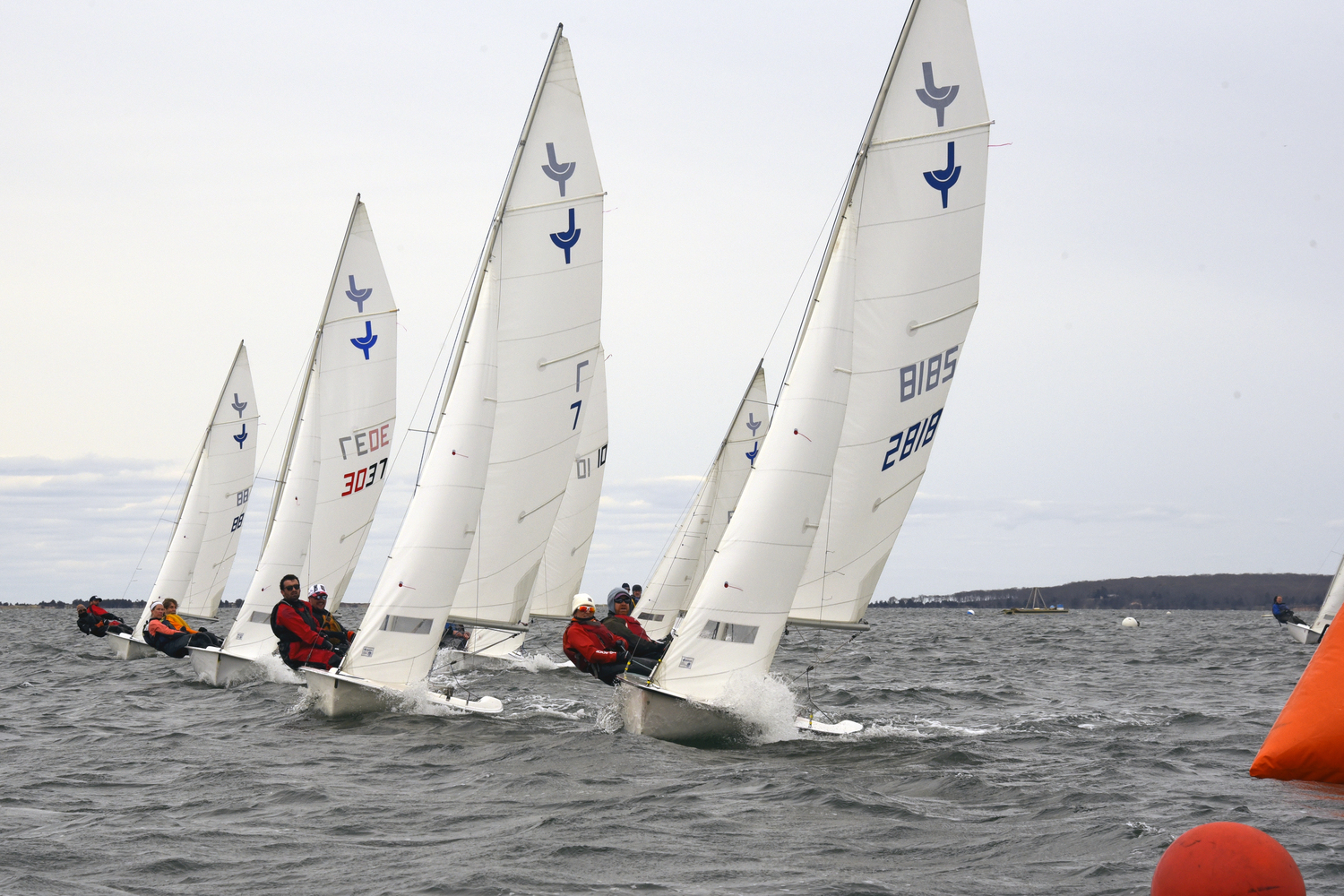 A race to the weather mark! First place sloop in this regatta is far left, a boat length ahead off their port side, Galen/Steelman and, far right, a nose ahead of the fleet, Beardsley/Rojas. MICHAEL MELLA