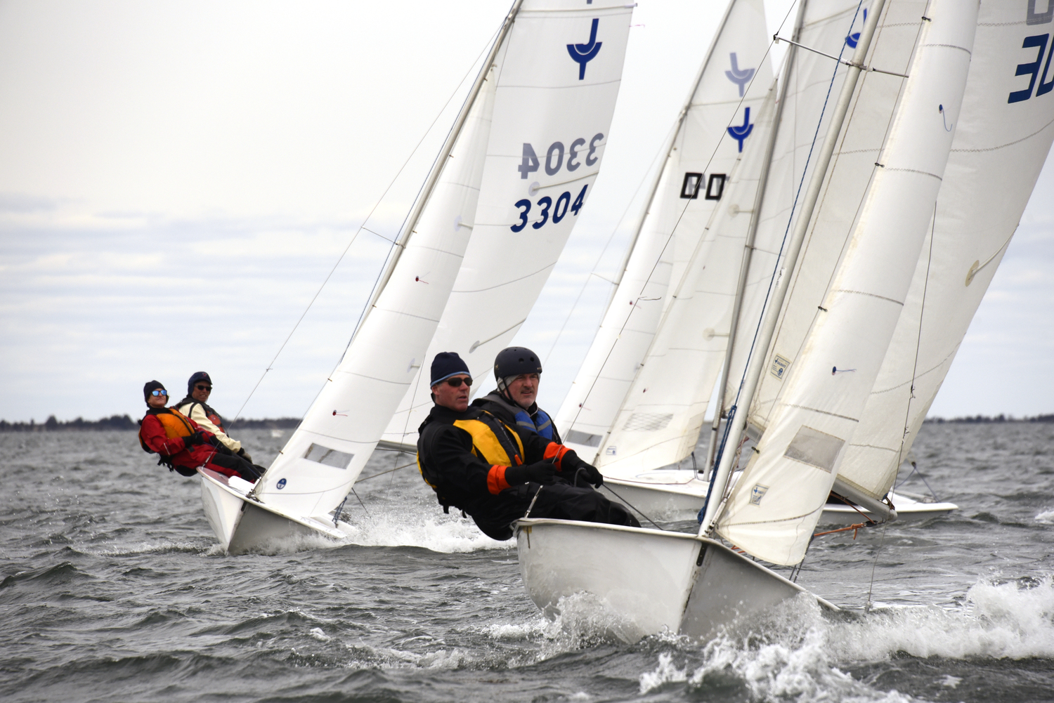 Photographer’s chase boat about to be T-boned by Welch and Deen. Far left is the terror of BYC Wednesday night racing, Purple Haze skipper Lee Oldak.  MICHAEL MELLA