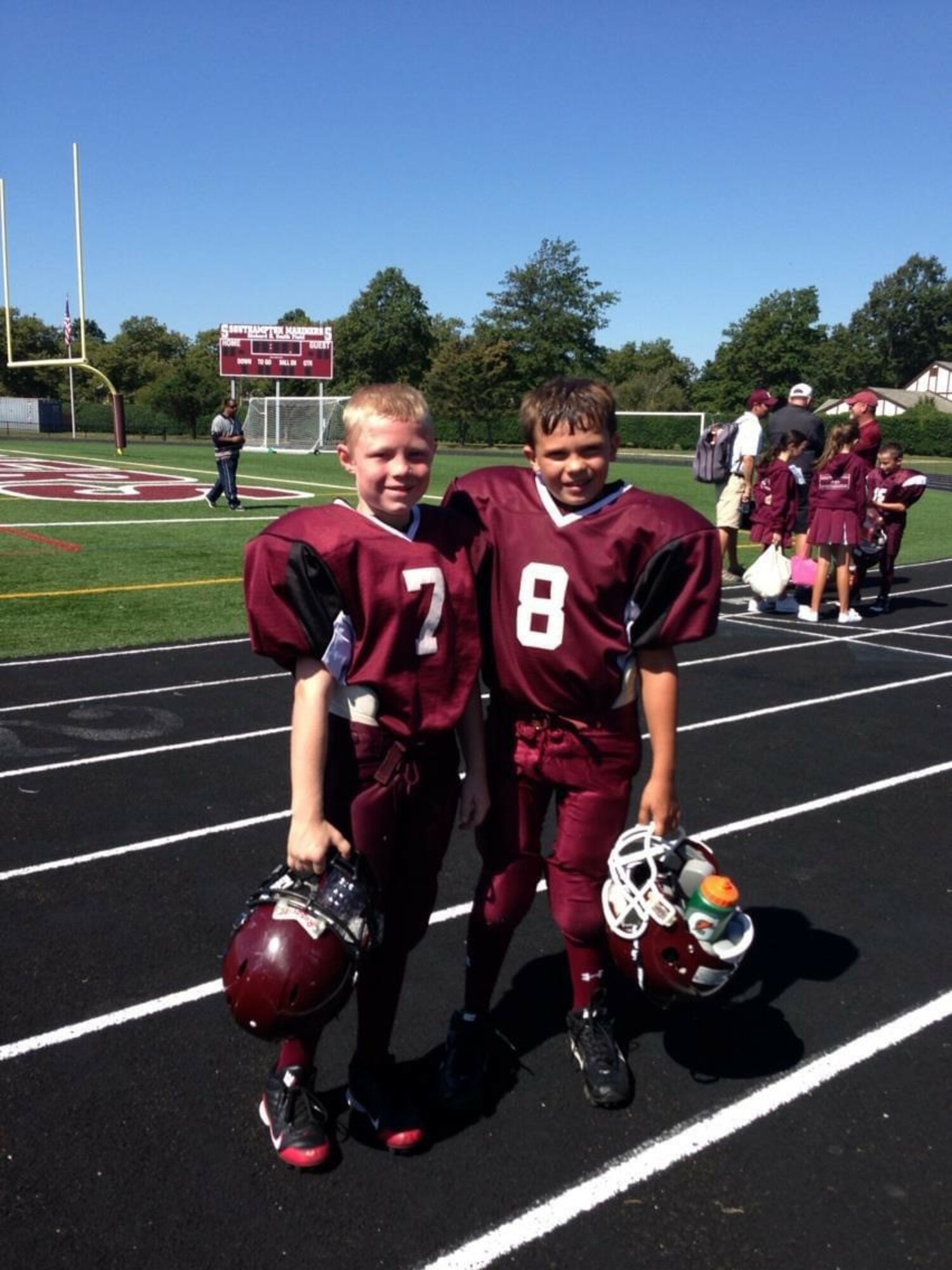 Mickey Brown, left, with his pee-wee Southampton PAL football buddy Justin Marro.   COURTESY LARA BROWN