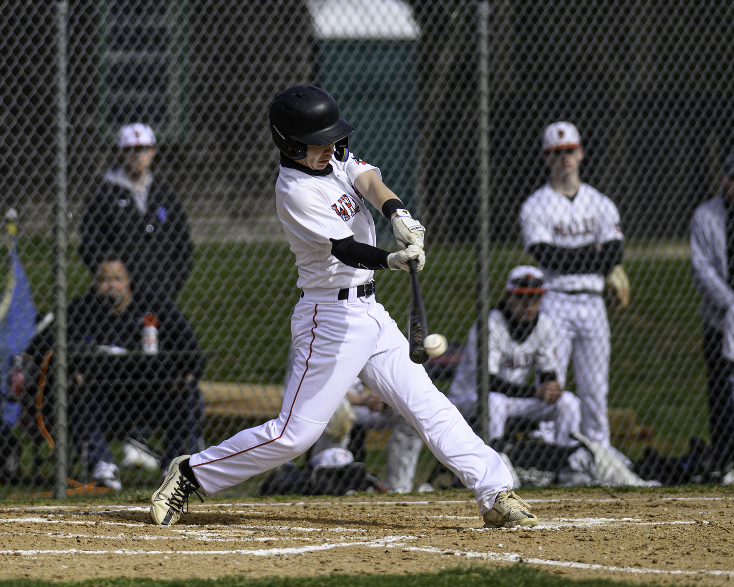 Pierson's Evan Mitchell makes contact for a base hit.   MARIANNE BARNETT