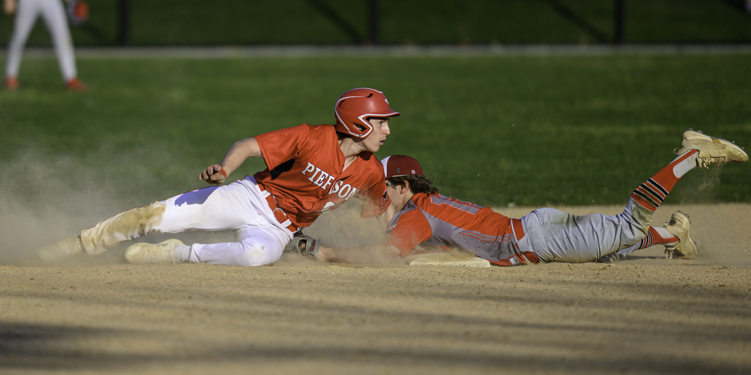 Lucas Iulo slides in safely with a stolen base.  MARIANNE BARNETT