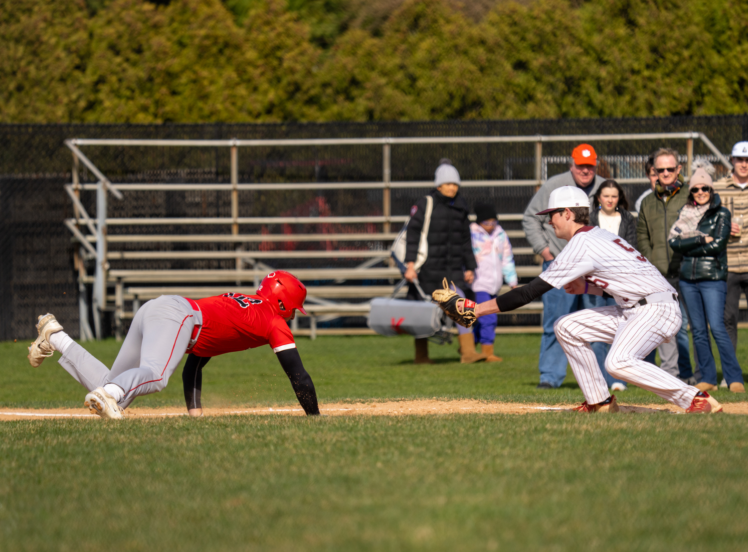 Southampton's Liam Blackmore tags out a Center Moriches base runner picked off of first base after receiving a throw from pitcher Thomas Crawford.  RON ESPOSITO/SOUTHAMPTON SCHOOL DISTRICT