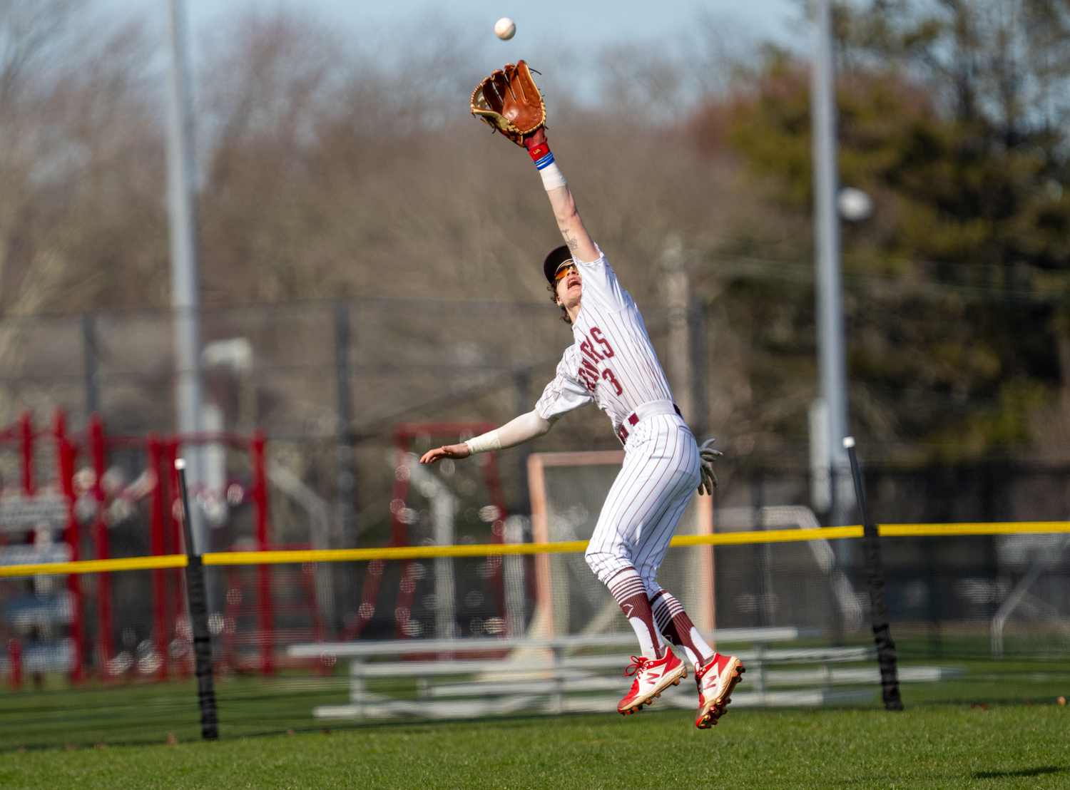 Southampton's Cameron Gratton has to reach up to make the catch in the outfield.   RON ESPOSITO/SOUTHAMPTON SCHOOL DISTRICT