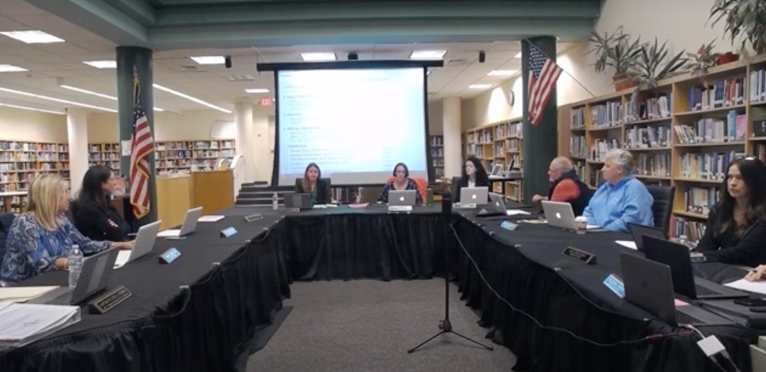 Westhampton Beach Superintendent Dr. Carolyn Probst, back left, and Board of Education President Suzanne Mensch, back right, speak to the crowd during Monday night's meeting.