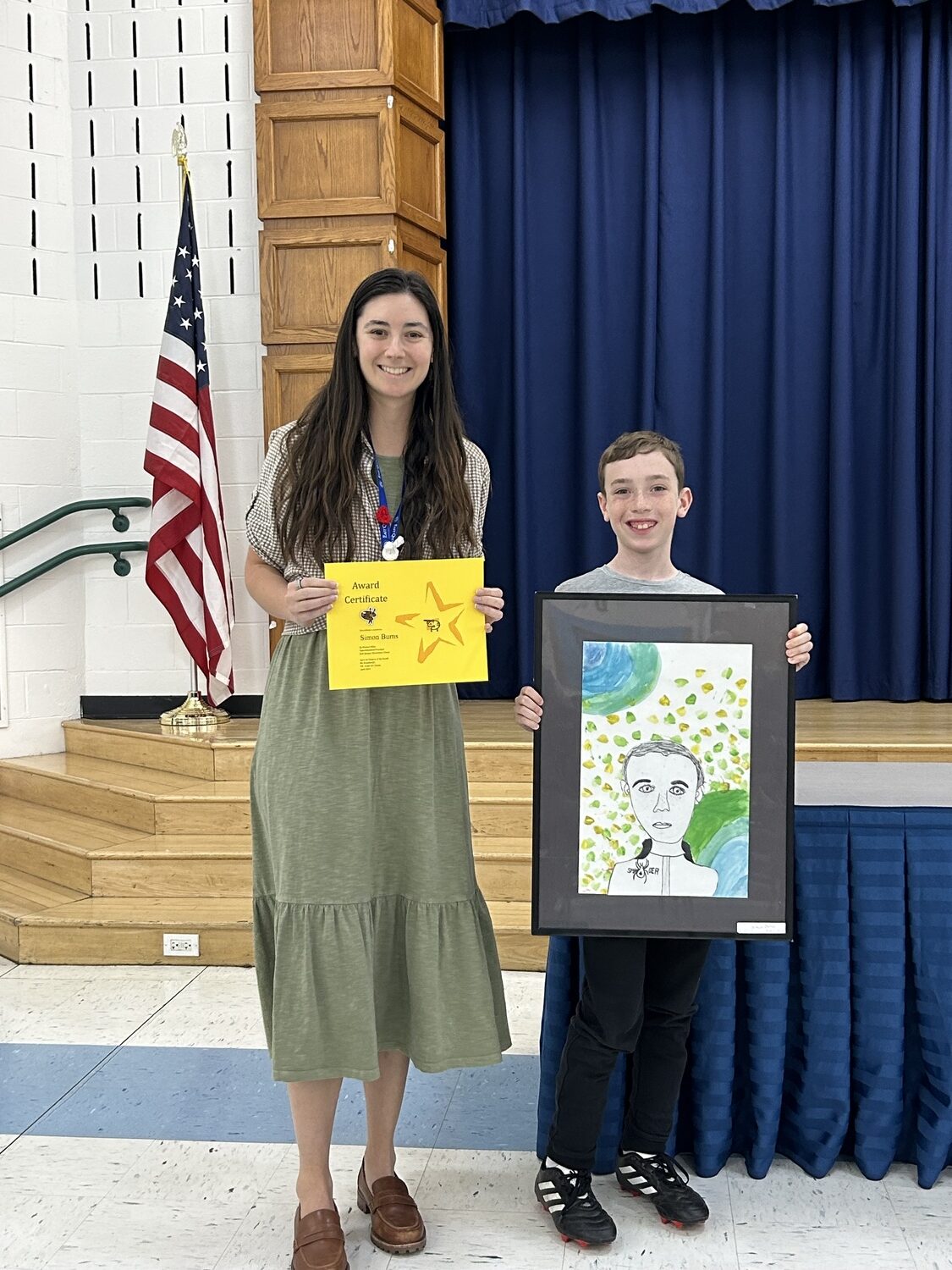 East Quogue School student Simon Burns,  with art teacher Lindsay Rosenberg, was selected as Artist of the Month for April. COURTESY EAST QUOGUE SCHOOL DISTRICT