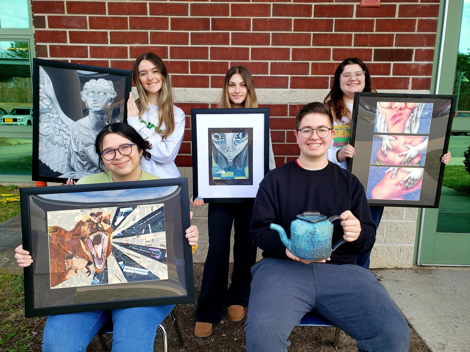 Eastport-South Manor Jr.-Sr. High School students Heather Moran, Alexandra Stefanidis, Grace Martin-Tsoupas, (front, l-r) Hailey Reilley and James Kreiling were selected to exhibit at Bay Area Friends of Fine Art's annual high school juried invitational art exhibit in Sayville. COURTESY EASTPORT-SOUTH MANOR SCHOOL DISTRICT