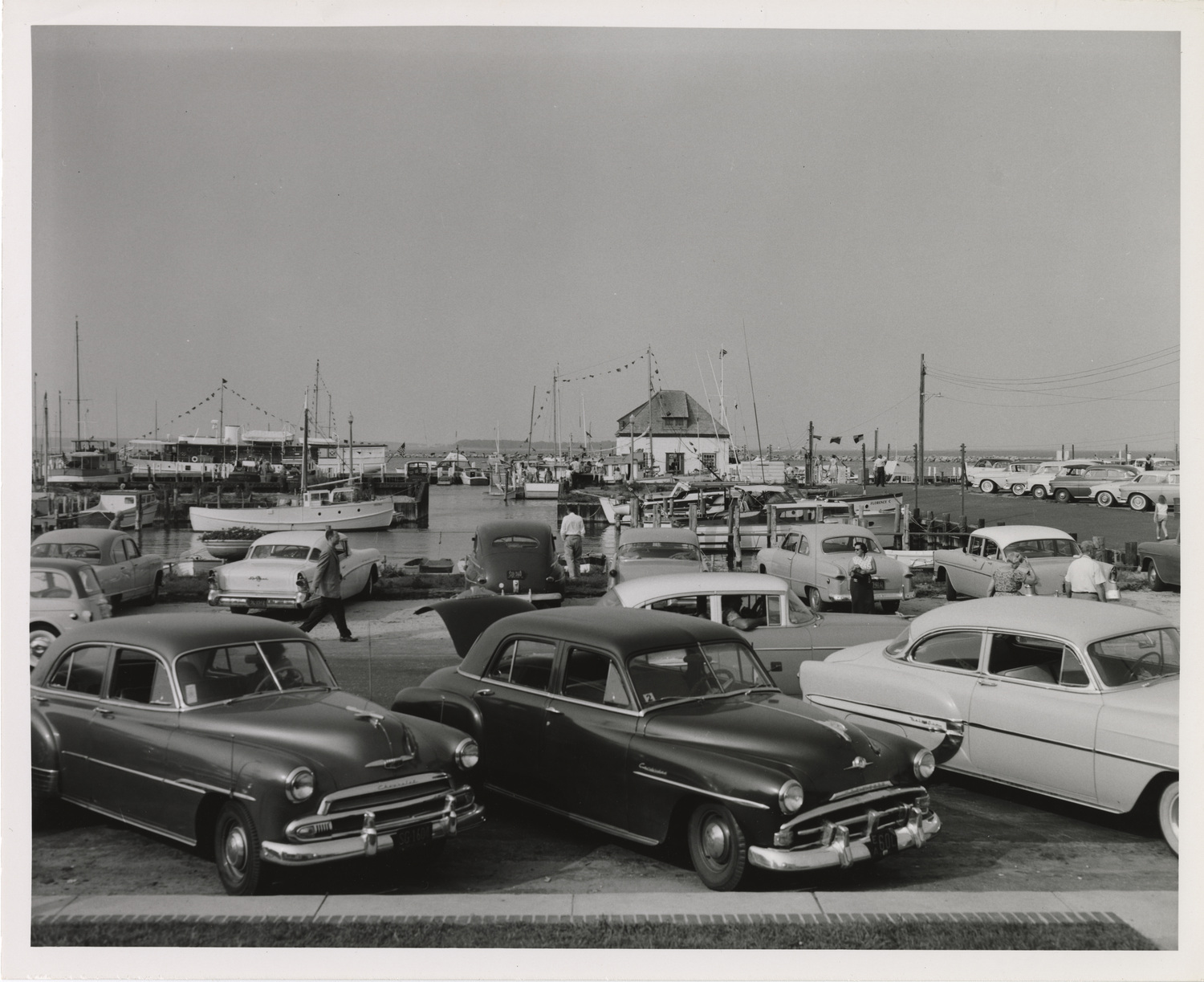 Cars parked on Bay Street with the Sag Harbor Yacht Club in the distance on Labor Day weekend in 1957 when the village celebrated its 250th anniversary. COURTESY JOHN JERMAIN MEMORIAL LIBRARY