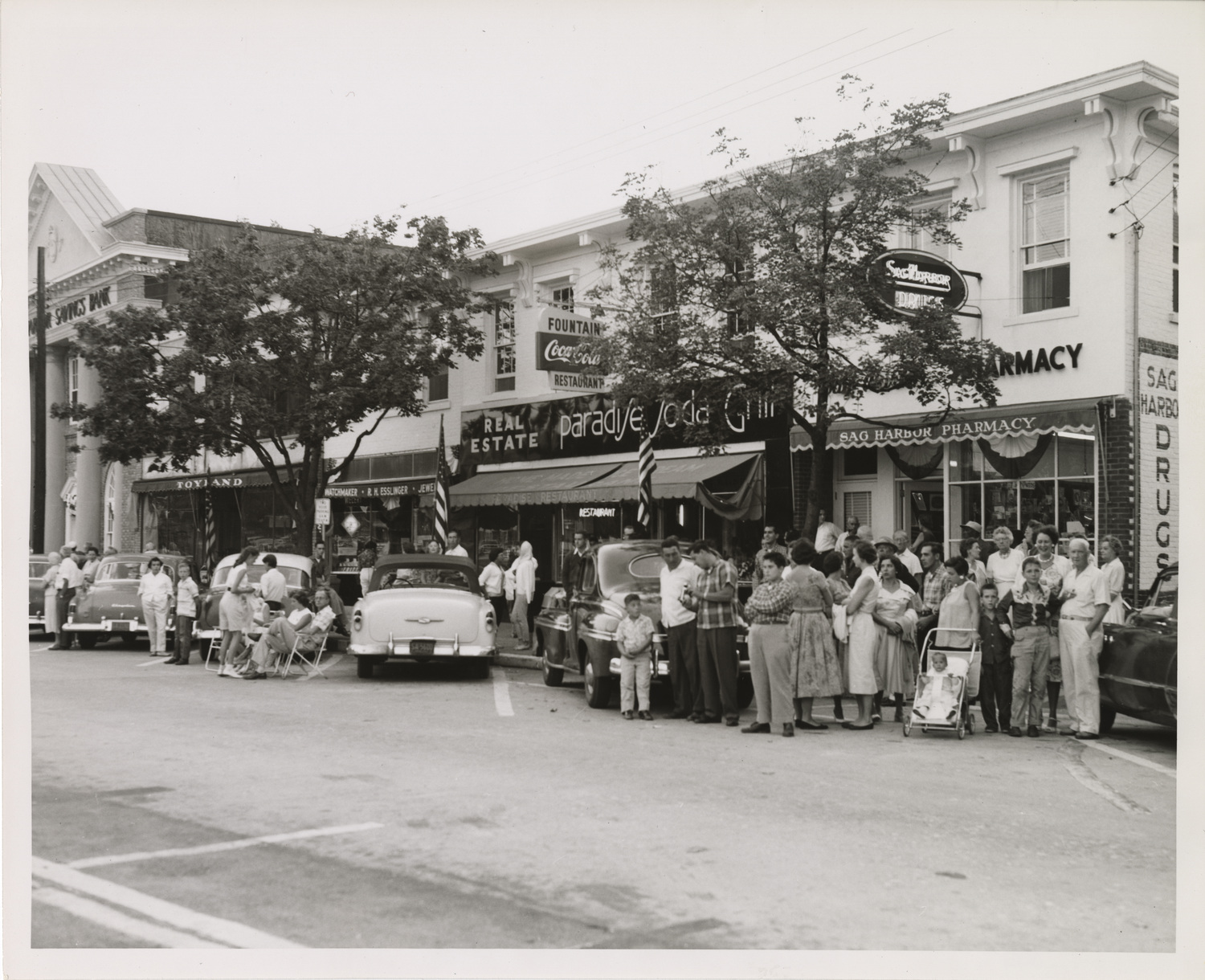 A view looking south on Main Street when Sag Harbor Village held a parade to celebrate its 250th anniversary on Labor Day weekend in 1957. COURTESY JOHN JERMAIN MEMORIAL LIBRARY
