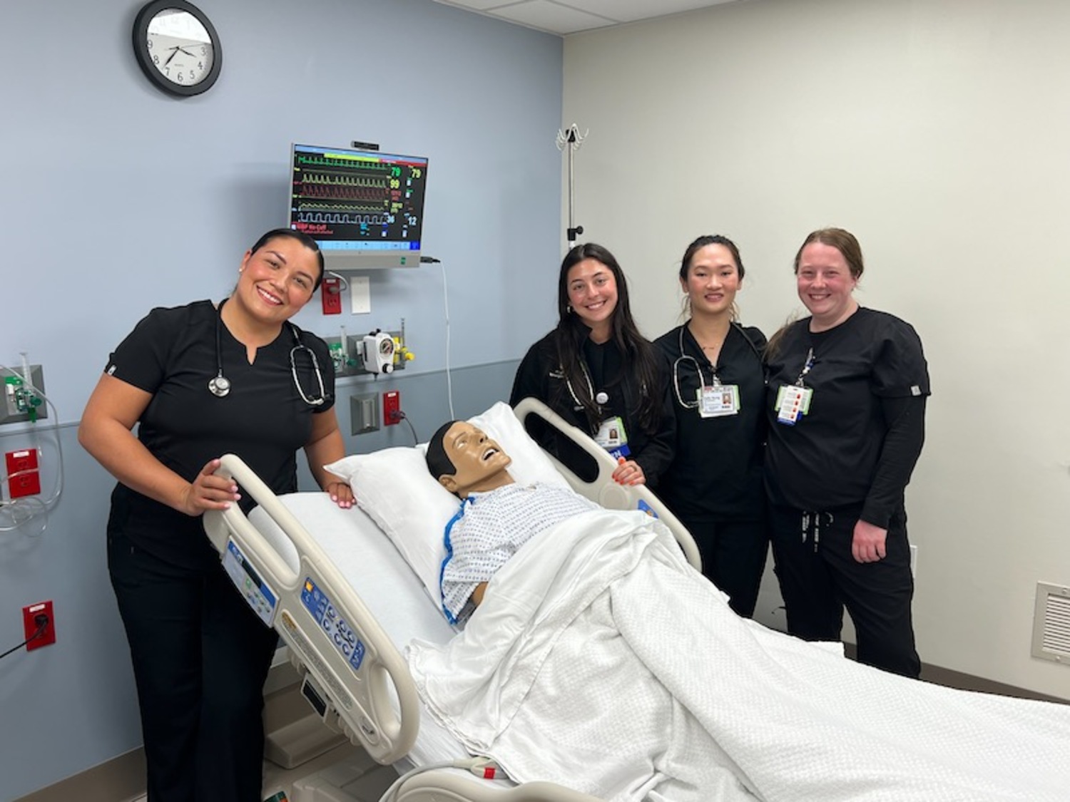 After the demonstration, nurses Jacksiry Vargas, Skyla Kloppenborg, Kelly Dung Bui Bruckner, and Andreya Weaver pose with “Peconic Pete.” RiverheadLOCAL/Alek Lewis