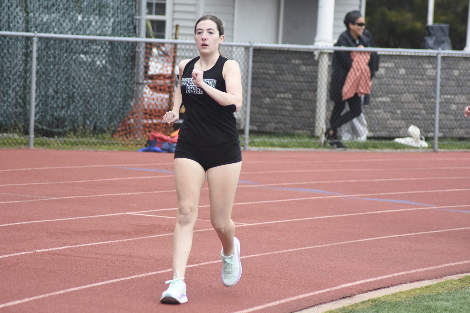 Grace Smith in the 1,500-meter race walk at East Hampton on April 19.   DREW BUDD