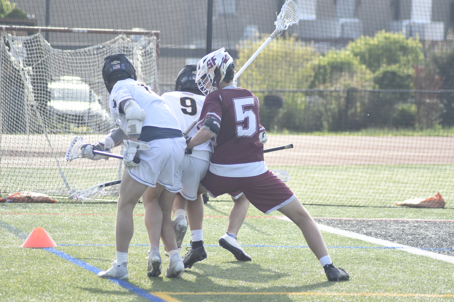 Southampton sophomore Nate Barbour tries to help teammate Theo Ball against a pair of Commack players.   DREW BUDD