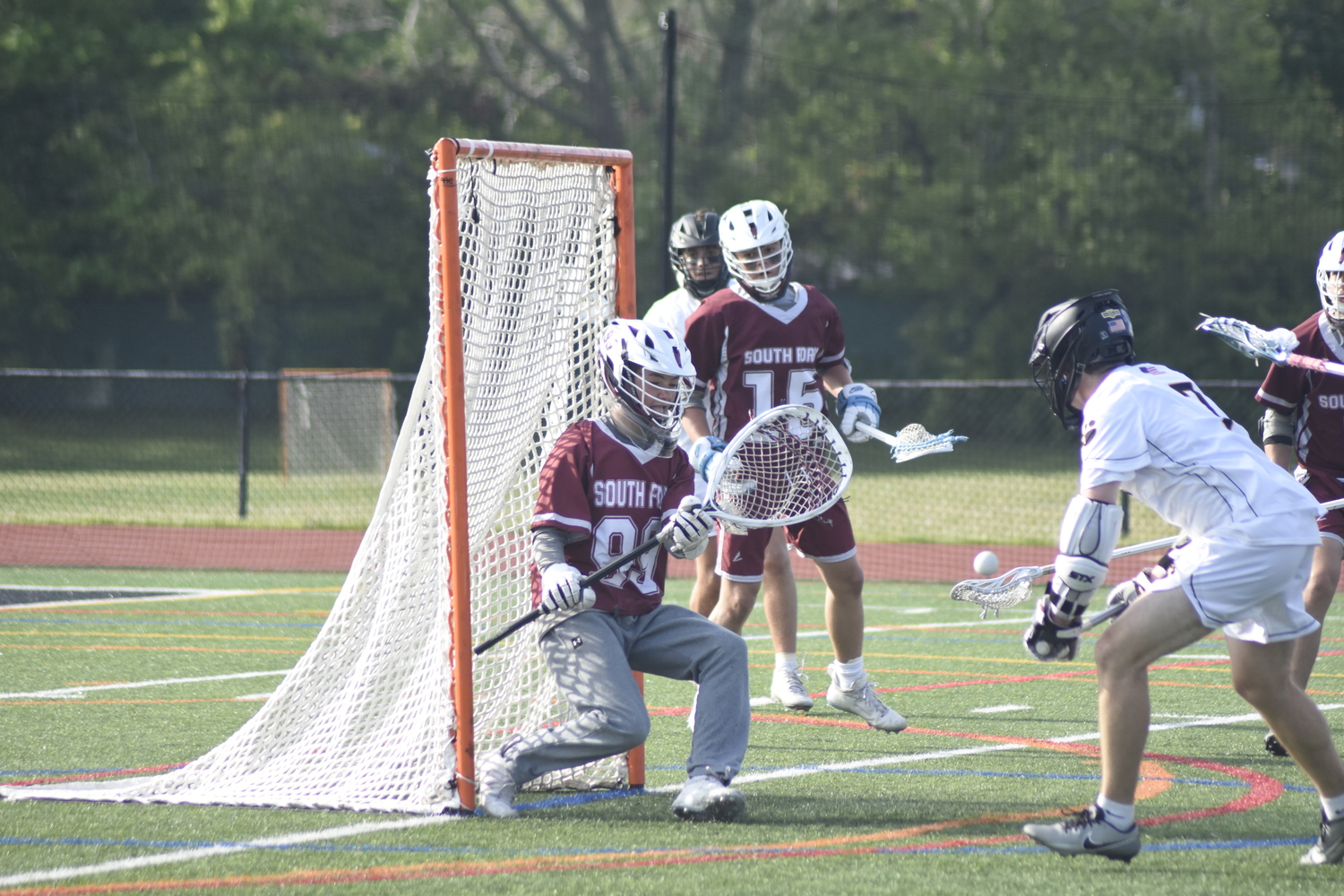 Southampton sophomore goalie Oliver Edson tracks the ball in front of his goal crease.   DREW BUDD